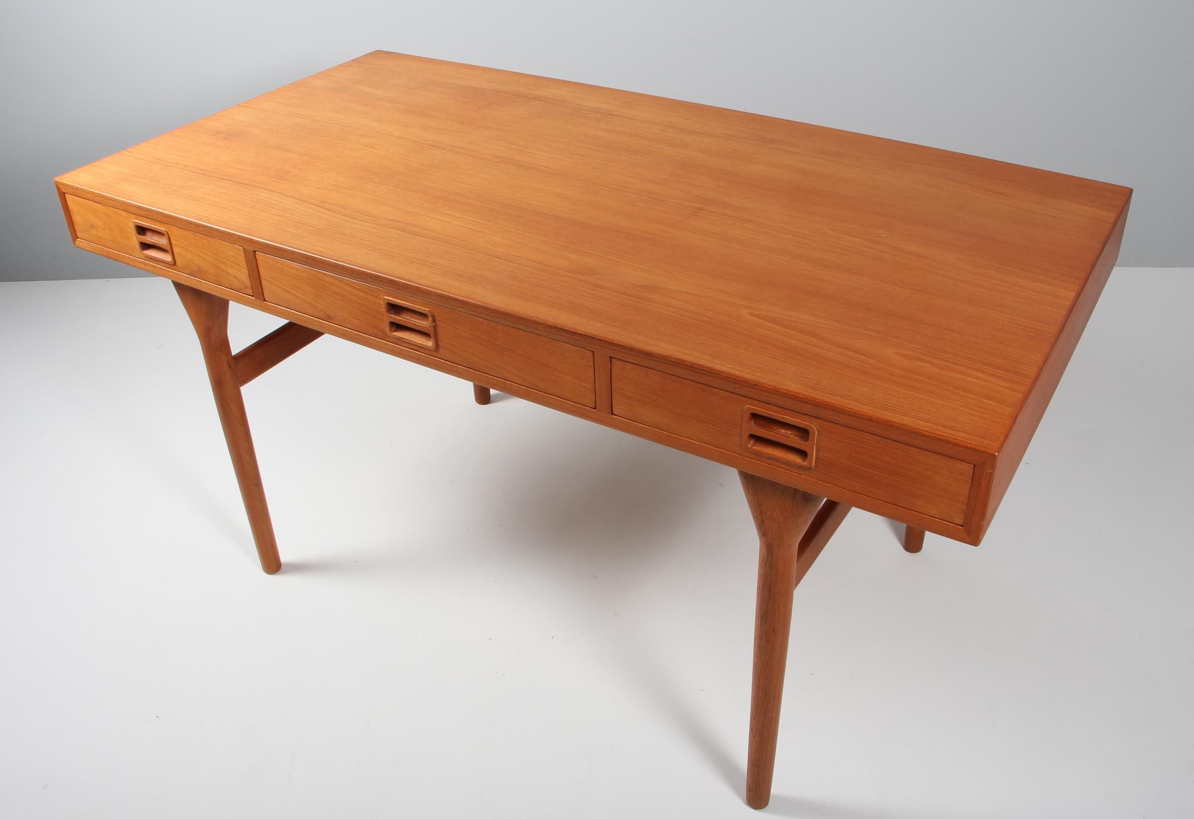 This elegant design by Nanna & Jørgen Ditzel serves as a desk, a writing table, library table, or even a console table in a large space. The spare, minimal form is delightful from every angle. Impeccably constructed by Søren Willadsen, the long top