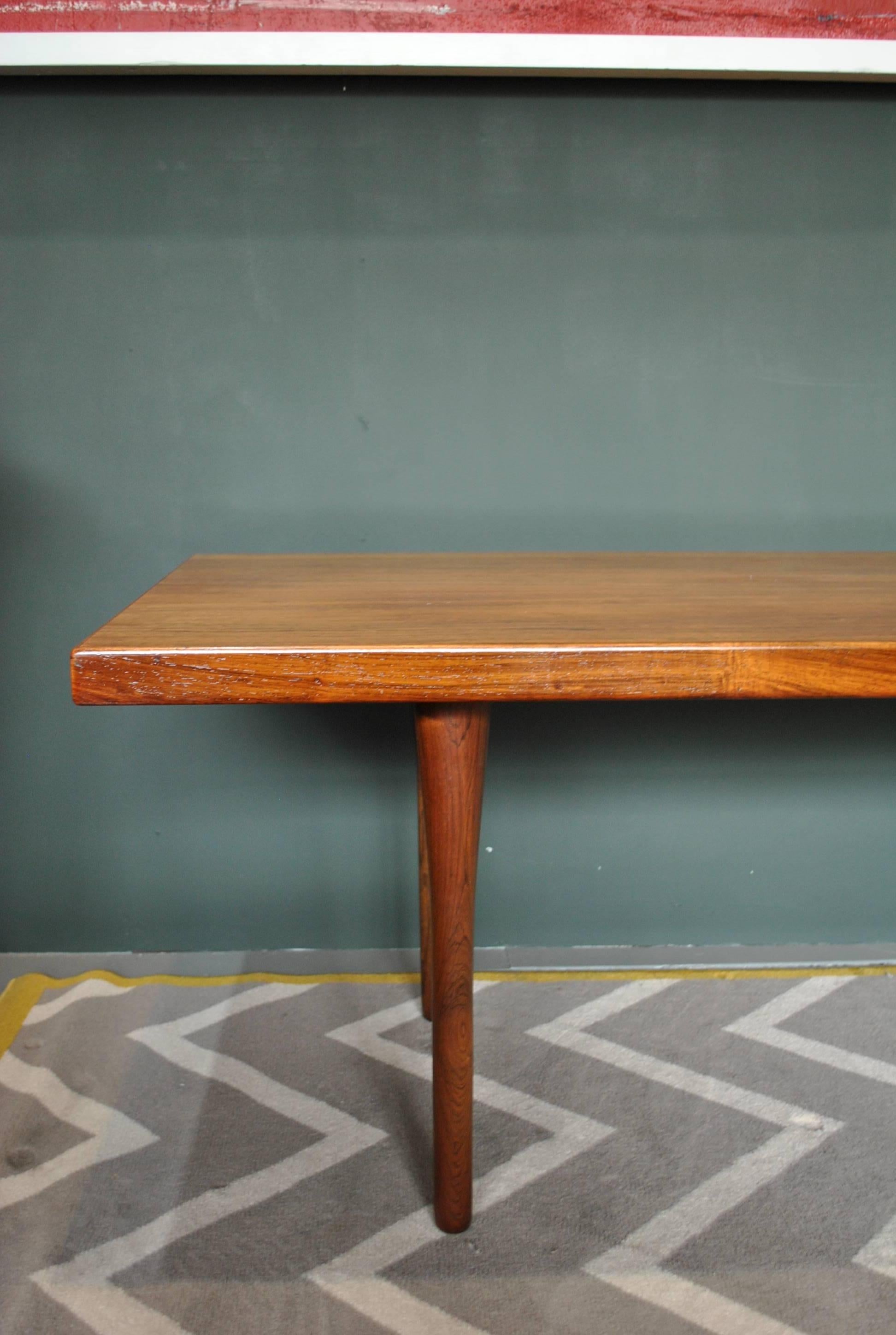 A rare Danish Midcentury coffee table designed by Nanna Ditzel for Søren Willadsen, Denmark, circa 1960s. Beautifully sculpted tapering legs. 
In good condition. Thoroughly cleaned and repolished throughout. The legs can be unscrewed (if required)