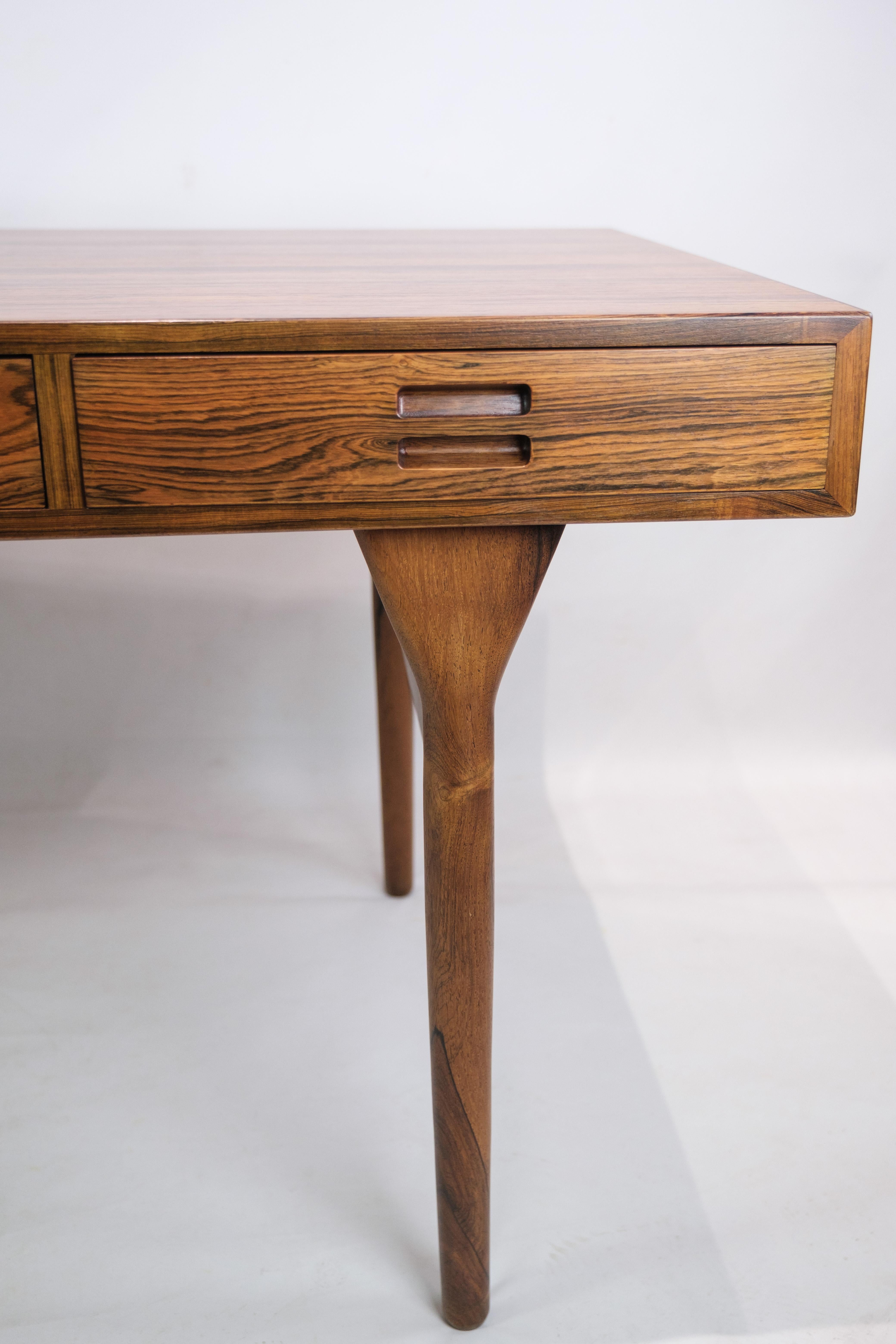 Nanna Ditzel rosewood desk, with four drawers, round conical legs. Designed 1958. Manufactured by Søren Willadsen, Vejen. The desktop has been recently refurbished.
Dimensions in cm: H: 71.5 W: 175 D: 75
Excellent condition

This product will be