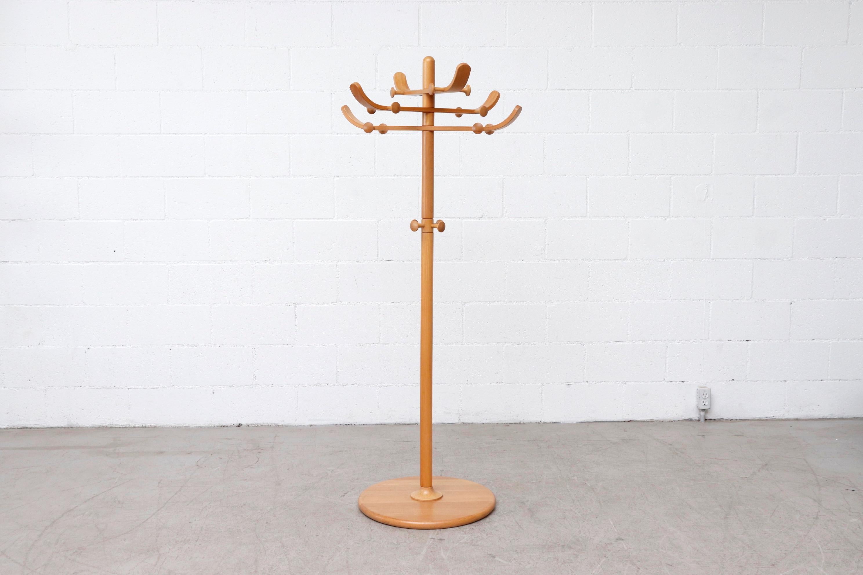 Lovely Nanna Ditzel style beechwood coat tree with 8 rotating bent wood arms and round wood base. In original condition with some scratches and visible wear. Threading inside the top section that attaches to the middle pole has worn over time and