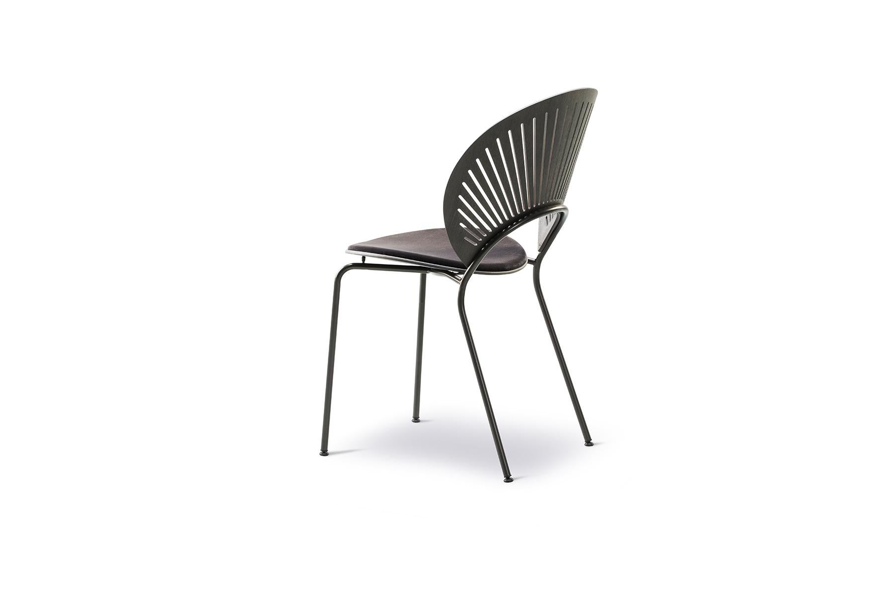 Nanna Ditzel Trinidad chair, seat upholstered the precise transparency of the Trinidad chair almost dissolves in a play of light and shadow, yet at the same time gives the chair a strikingly bold voice. The chair without arms is stackable and comes