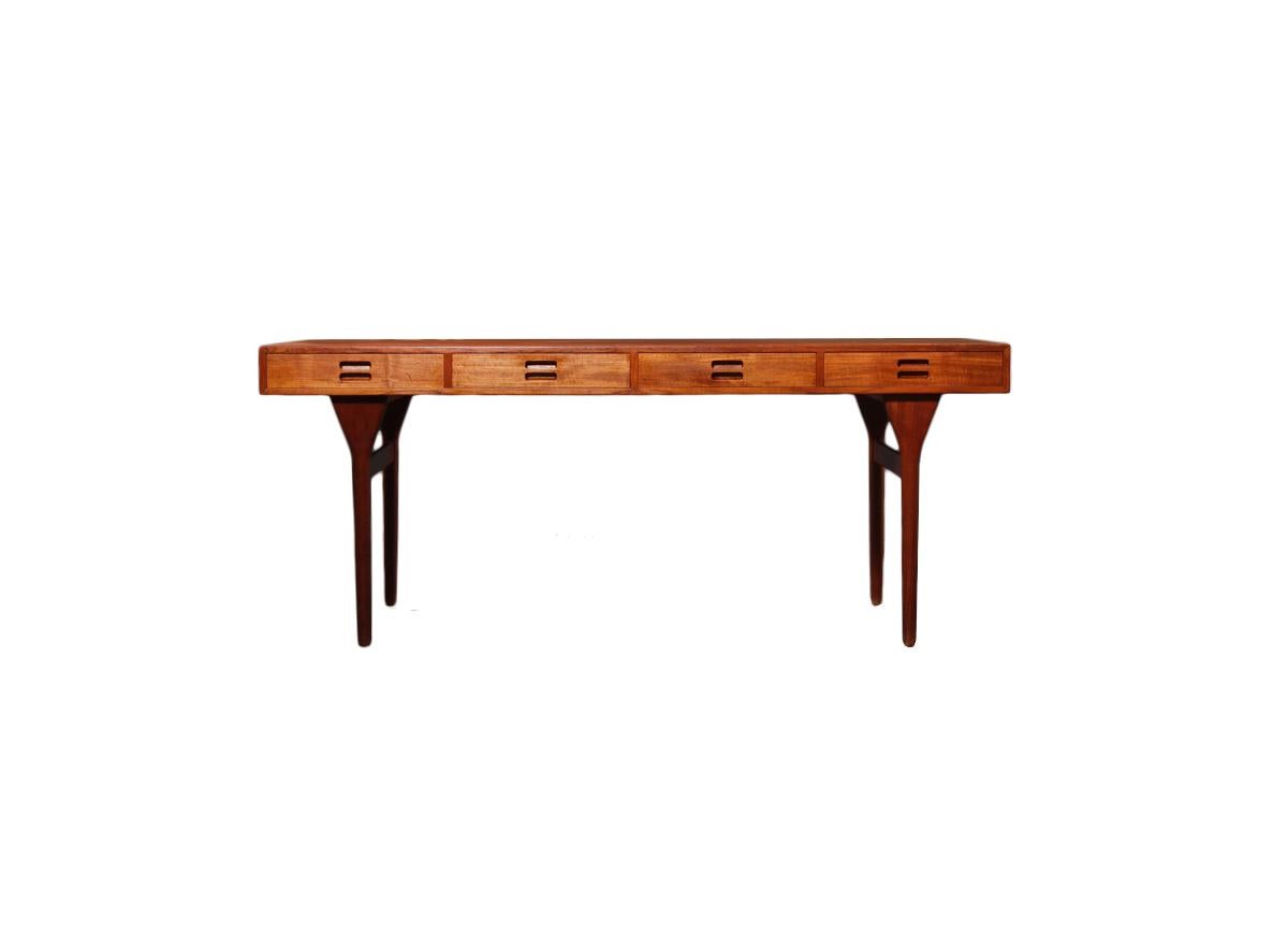 A teak writing desk by Nanna Ditzel for Søren Willadsen. This desk is truly a Danish design icon and one of Ditzel’s most sought after designs. This model #93-4 desk is Danish design at its best and showcases the simplicity and functionality of what