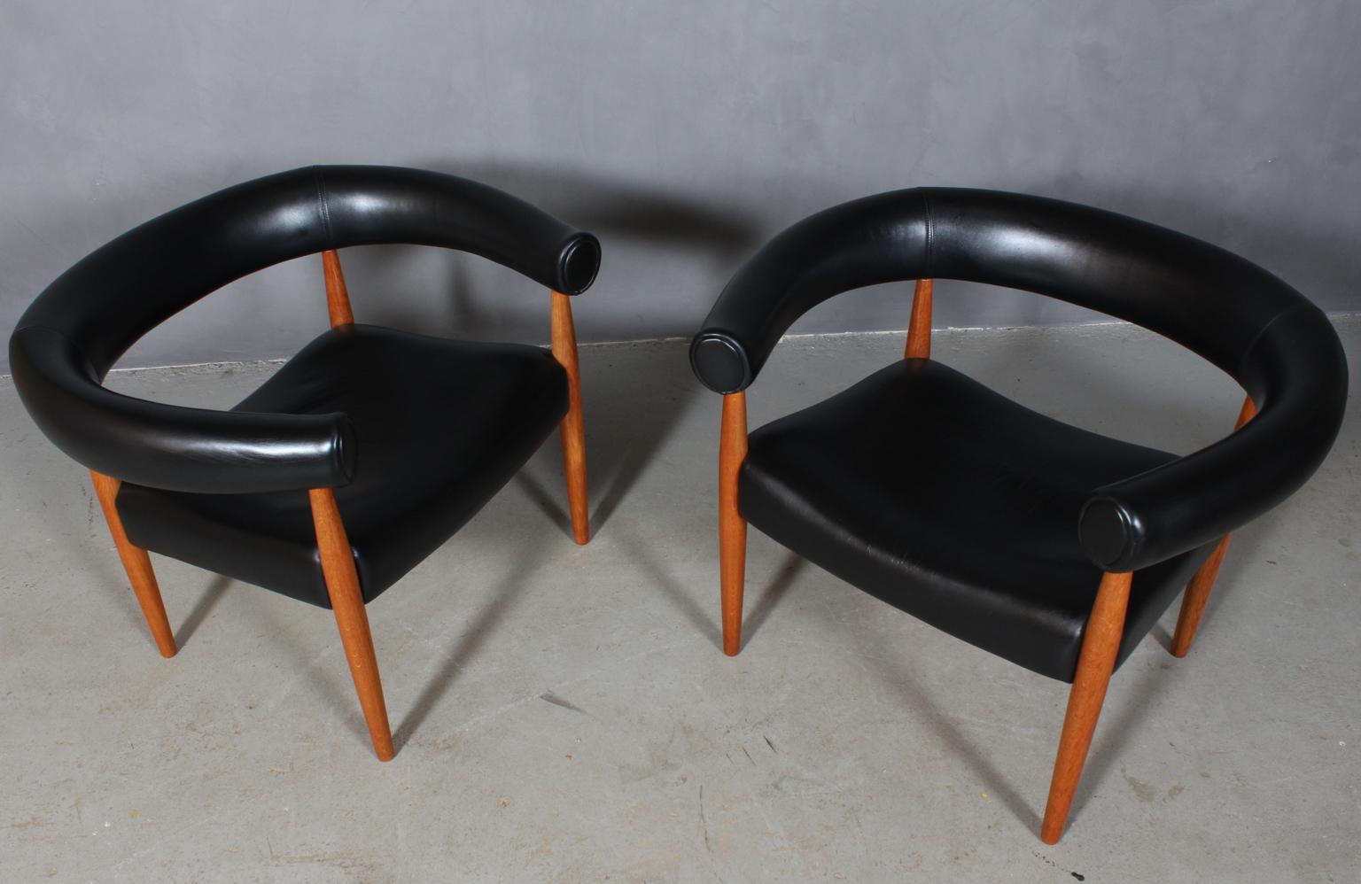 Nanna & Jørgen Ditzel. Two ring armchairs in oiled oak.

Upholstered with black patinated leather.

Made by Kolds Savværk.