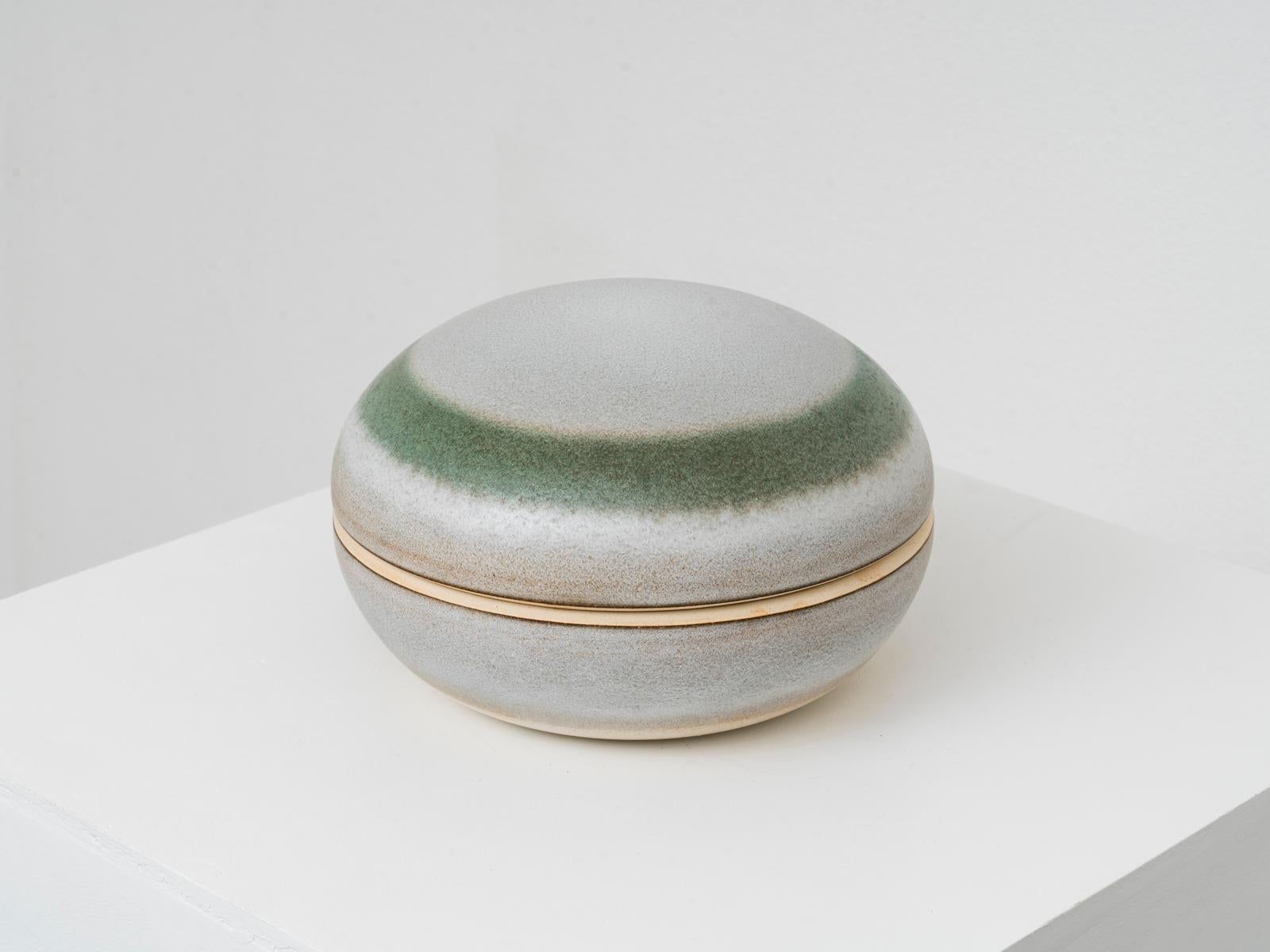This ceramic lidded container or centerpiece was designed by Italian master ceramicist Nanni Valentini for Ceramica Arcore, where pieces were crafted by Valentini himself and Marco Terenzi. The piece is made of enameled stoneware, is signed 
