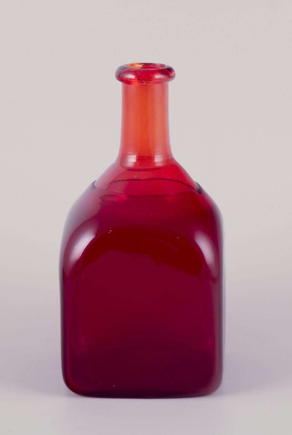 PRE-OWNED GOODS ARE EXEMPT FROM IMPORT TARIFFS FOR U.S., UK, AUSTRALIAN & CANADIAN CUSTOMERS.   
THEREFORE, NO IMPORT TARIFFS WILL BE APPLICABLE TO YOUR PURCHASE. 

Nanny Still for Riihimäen Lasi, Finland.
Decorative bottle in red and orange art