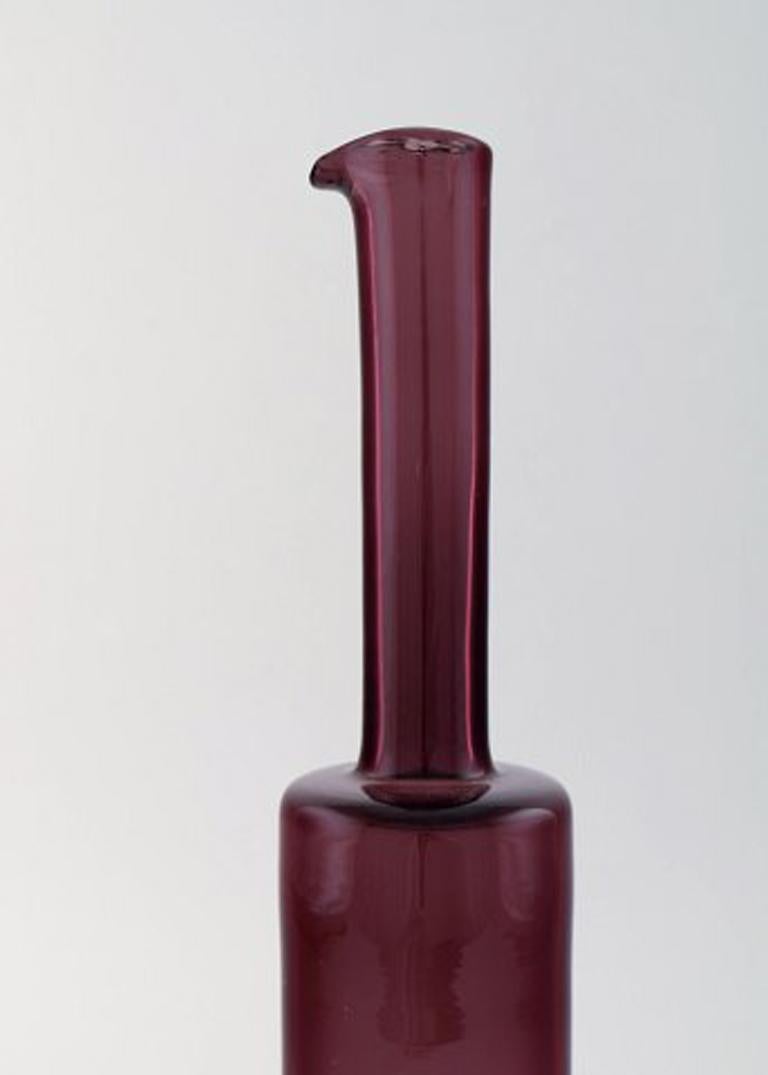 Nanny Still for Riihimäen Lasi, Finnish art glass decoration bottle vase or pitcher.
In perfect condition. Beautiful purple color.
1960s-1970s.
Measures: 33.5 x 6 cm.