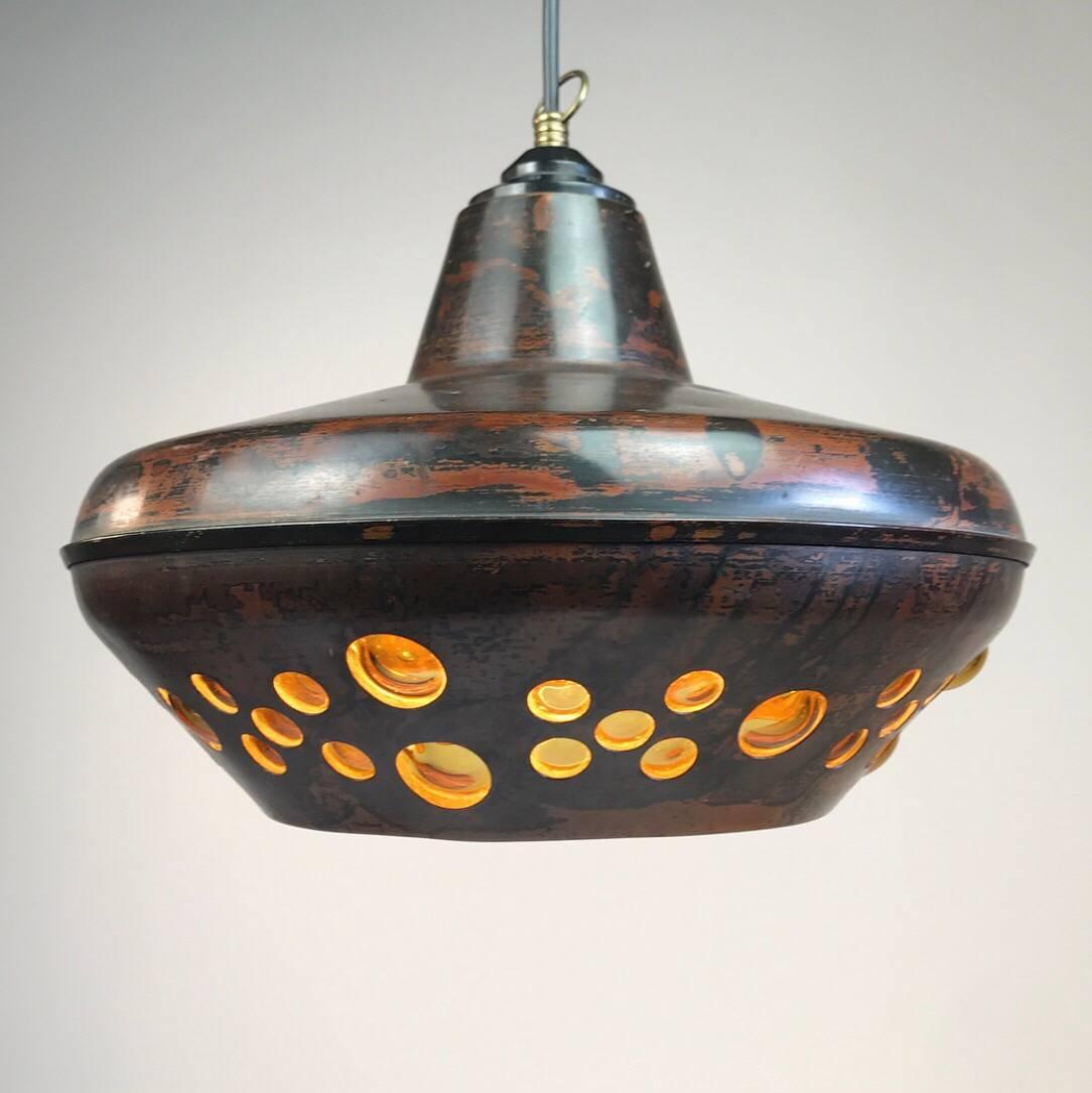 A real raw bohemian design ceiling light by Nanny Still McKinney for RAAK 1960s.

Beautiful shaped black copper oxidized pendant with hand blown amber colored glass. 

Very good vintage condition with only few age related signs of use.

Light