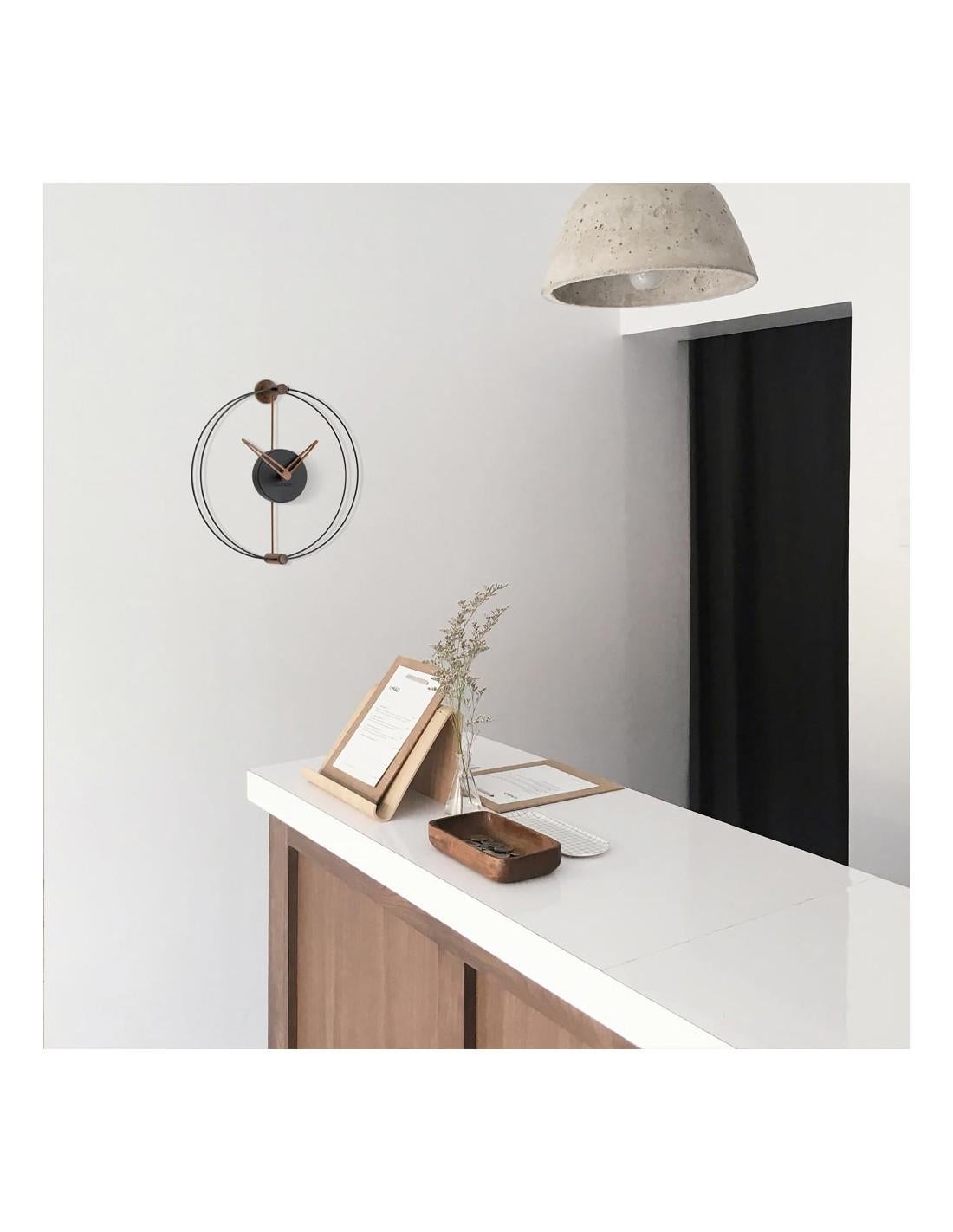 The modern Nano clock has an avant-garde design with a Nordic air, combining walnut wood or oak finish with black and white colors.
Nano wall clock: Hands and details in walnut or oak finish, box in black or white polystyrene.
Each clock is a
