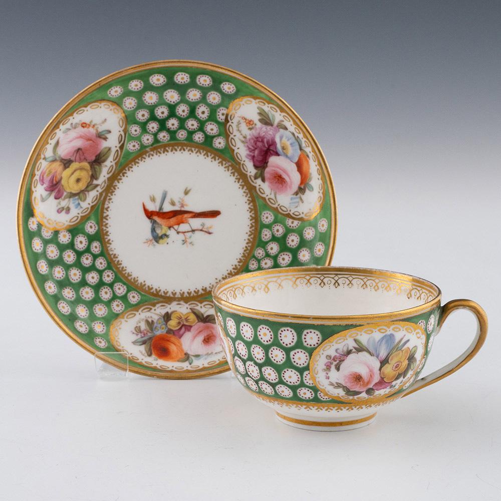 Heading : Nantgarw porcelain teacup and saucer
Date : 1818-20
Period :Regency
Origin : Nantgarw, Wales. Possibly London decorated
Colour : Polychrome
Pattern : Three garden flower panels with gilt borders and apple green ground containing gilded