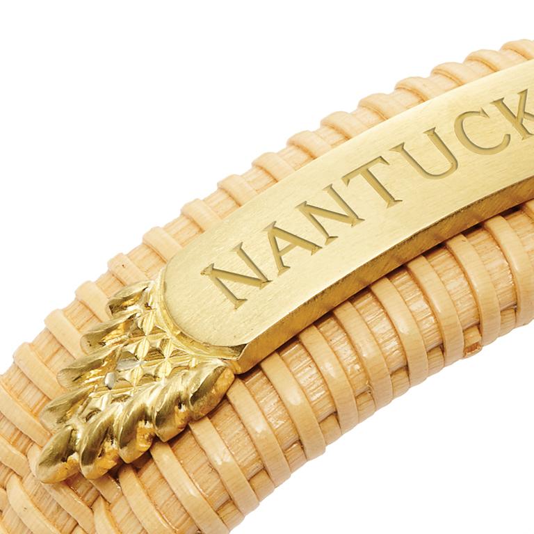 Hand woven Nantucket Basket Quarterboard Bracelet in 18 Karat Gold, with Whale Ivory endcaps. Shown here with Nantucket.
May also be custom engraved with your name, your house, your boat, your choice!

Price is inclusive of hand engraving up to 19