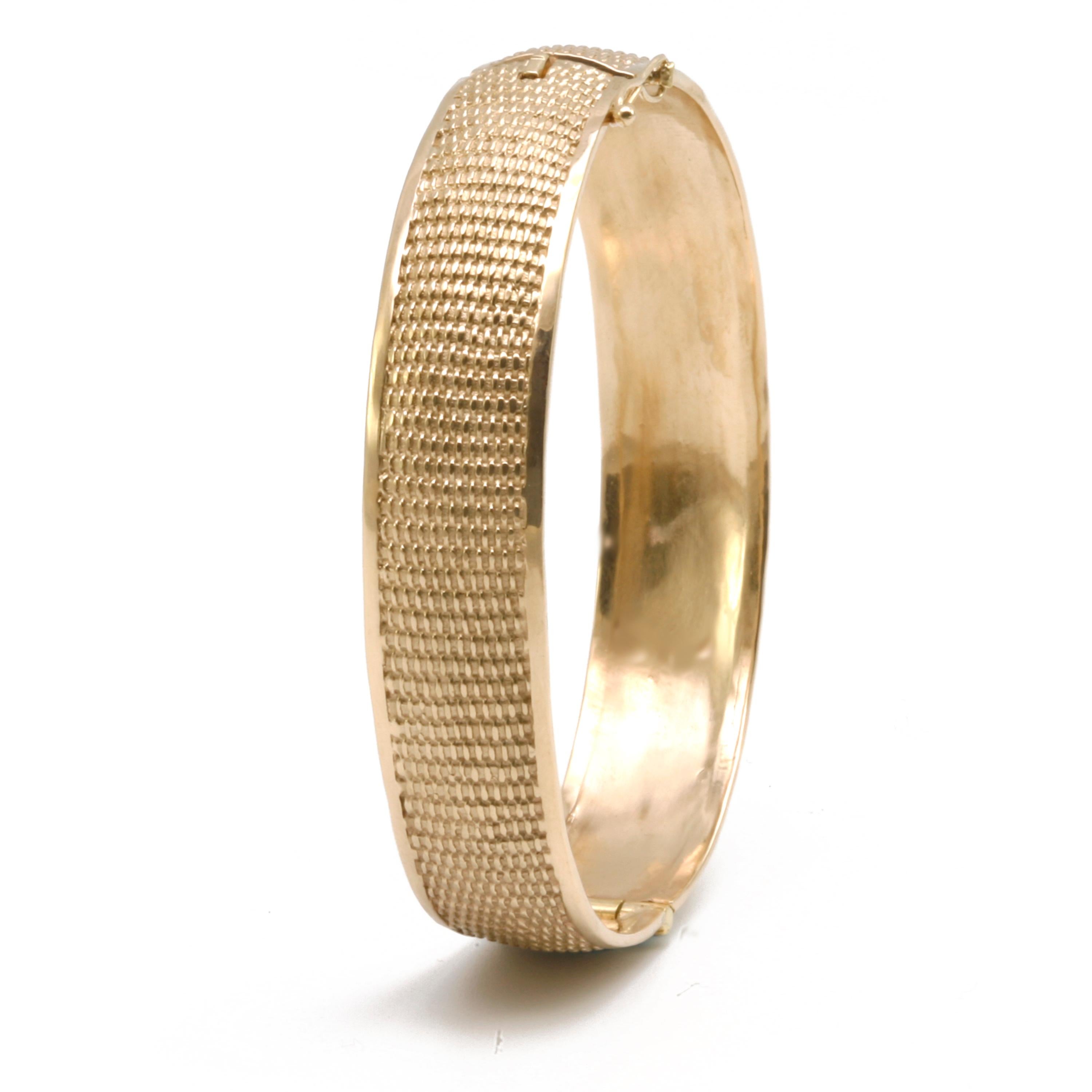 A well-known texture known as a Nantucket Basket Weave is presented here in a substantial woven textured Hinged Bangle in 14k Gold. Available in
three sizes. All gold karat and colors. Platinum also available.
The process for making a very precise