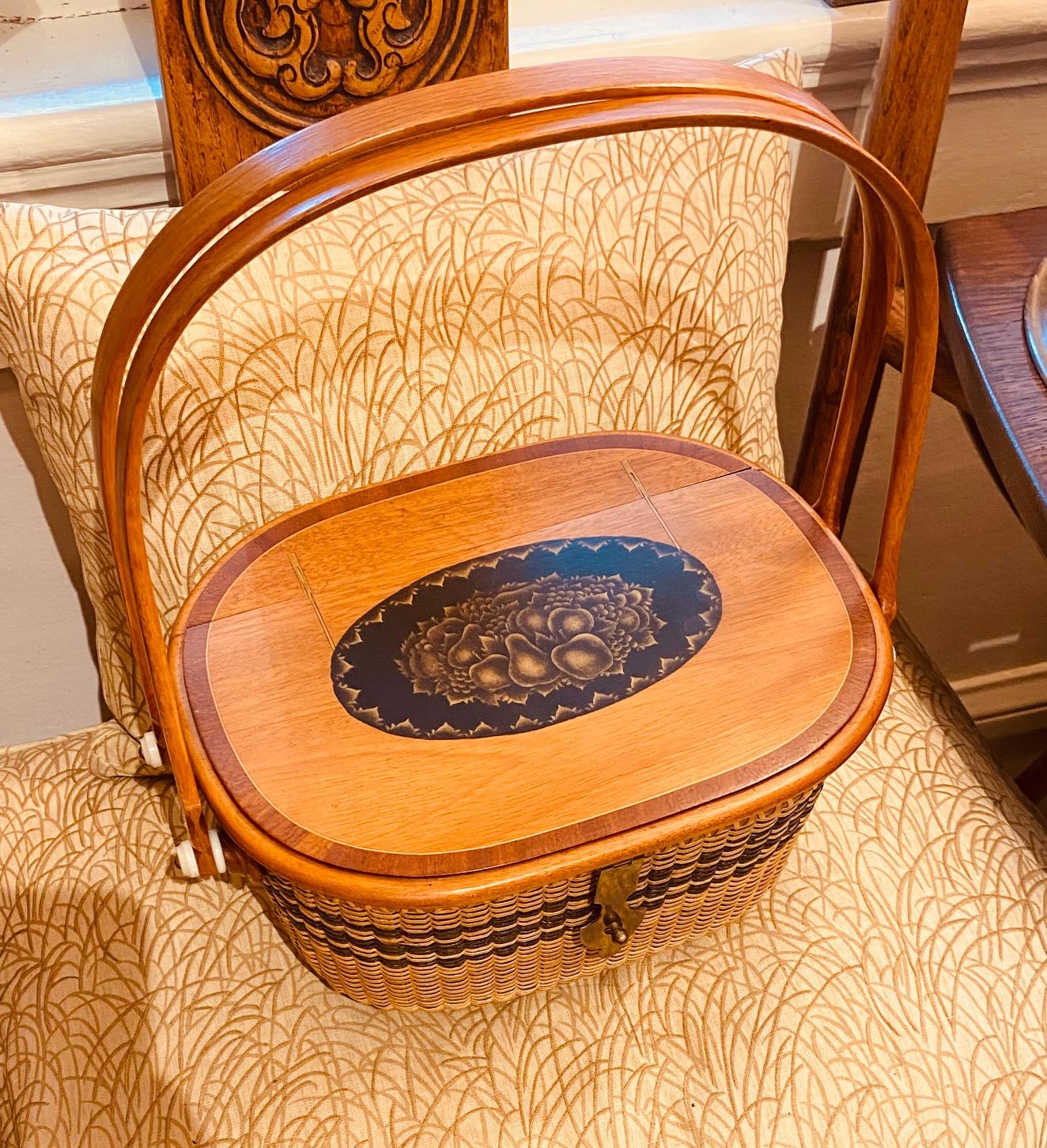 Nantucket Basket by Harry Hilbert, 1995, a Nantucket purse having a solid mahogany hinged top with colonial or federal style stenciled decoration on ebonized reserve, fine brass hinges minutely inlaid, and tropic wood cross-band inlay around