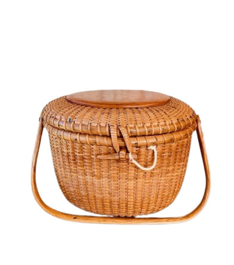 Nantucket Cocktail Purse by Jose Formoso Reyes, circa 1950, a very early Nantucket diminutive oval woven purse made during the first few years Reyes was making Nantucket baskets, having a cane weave on rattan staves, pine top and bottom plates,