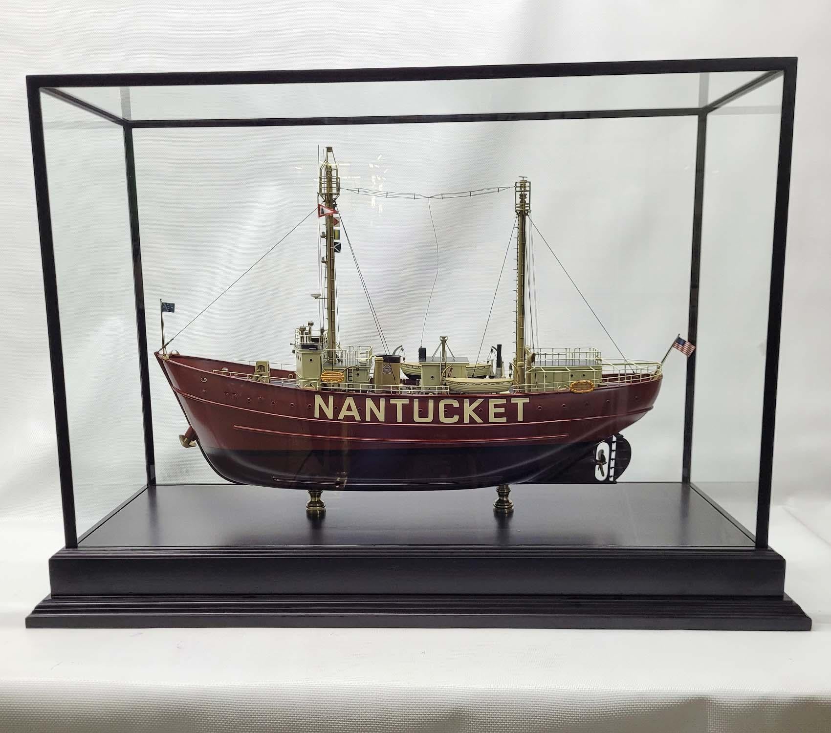 Fine model of the US Coast Guard Lightship “Nantucket”. Exceptional Model with carved hardwood Hull. The masts and many of the fittings are milled brass. Details include Railings, stove pipe, lifeboats, cabins, bell, bollards, foghorn, beacons,