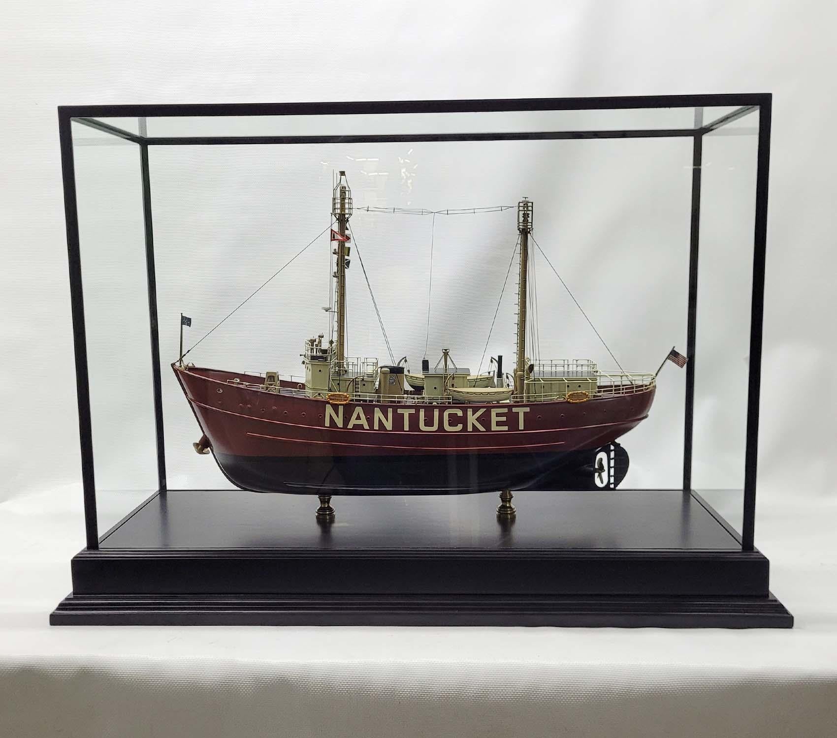 Fine model of the US Coast Guard Lightship “Nantucket”. Exceptional Model with carved hardwood Hull. The masts and many of the fittings are milled brass. Details include Railings, stove pipe, lifeboats, cabins, bell, bollards, foghorn, beacons,