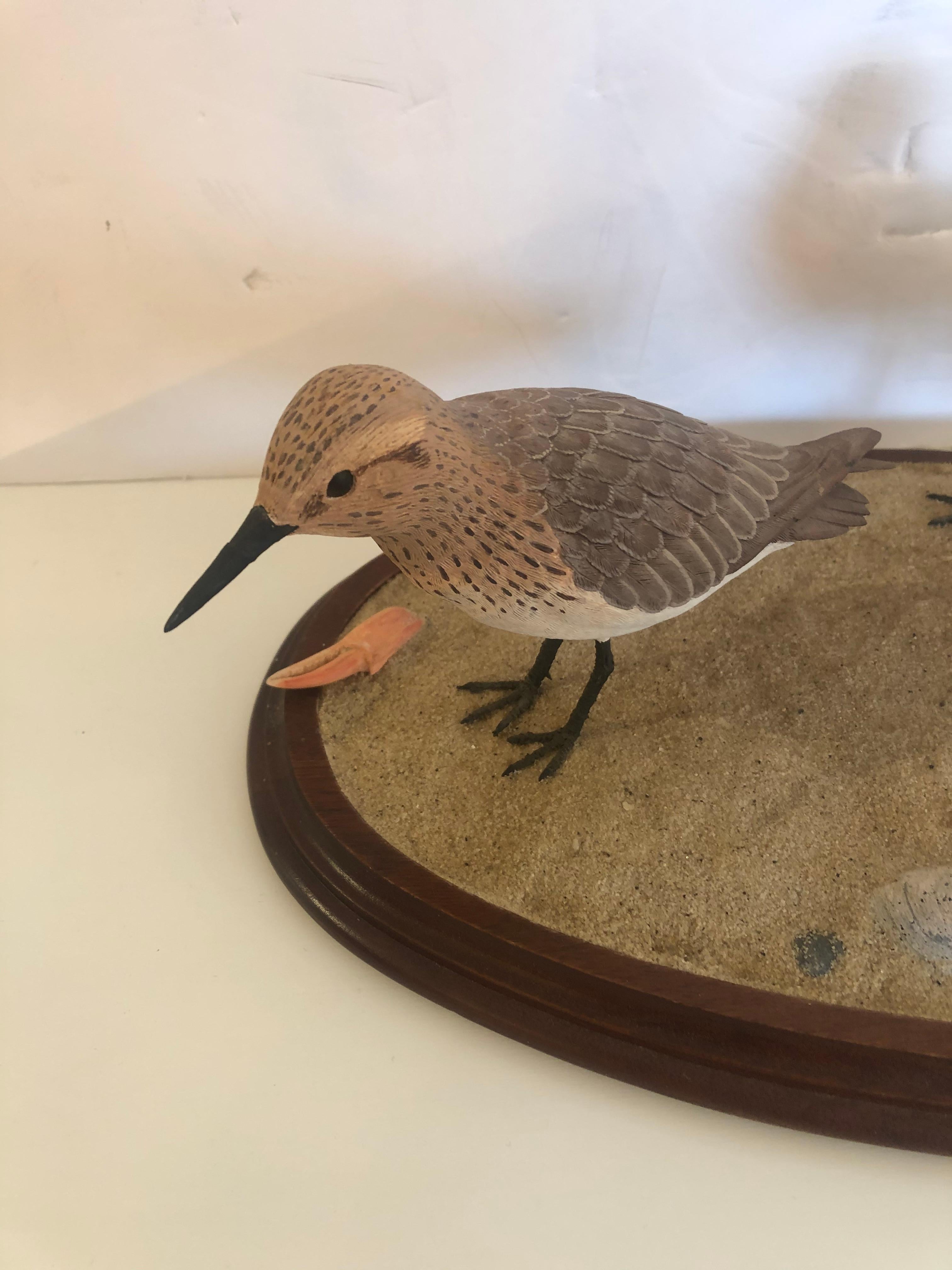 Beautiful hand artisan made sculpture of 3 life like sandpipers on oval wooden platform having sand and shells. Perfect for a stylish beach house, or a reminder of summer days in any house.
Signed on the back '87 J S Meyer.