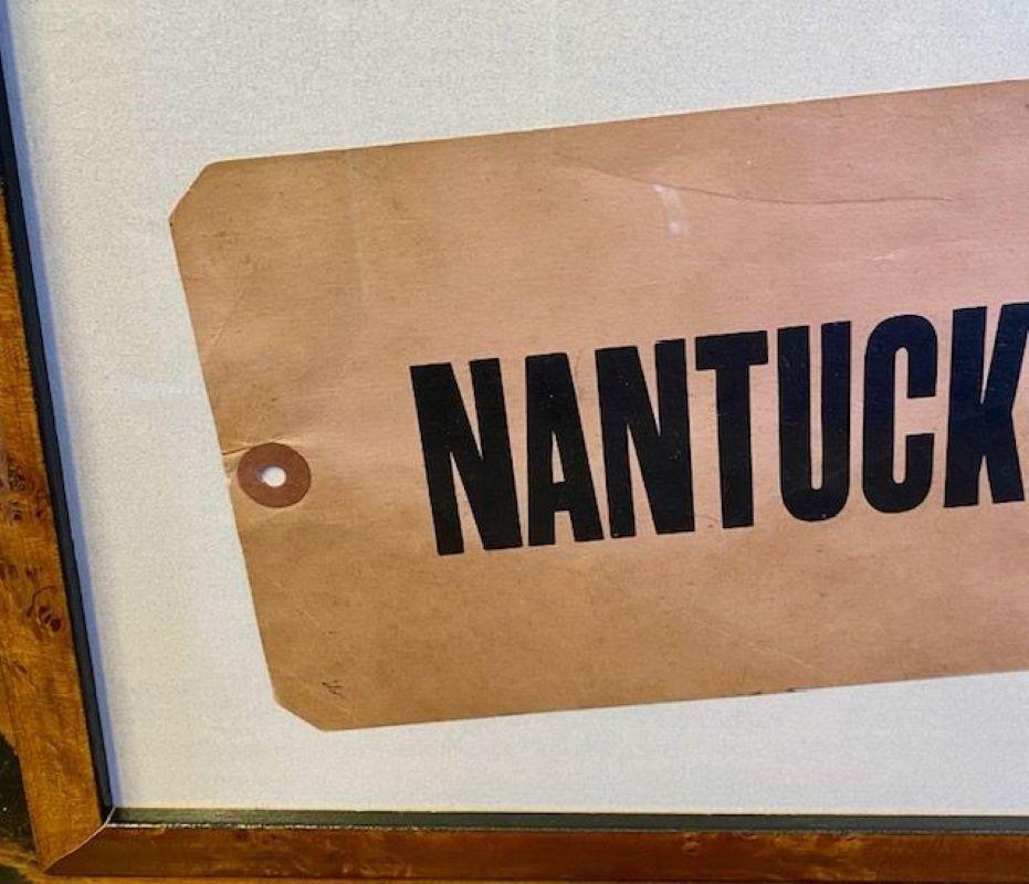 Antique Nantucket Steamship Luggage Tag, circa 1920s, heavy stock paper or card in faded red with the printed inscription 