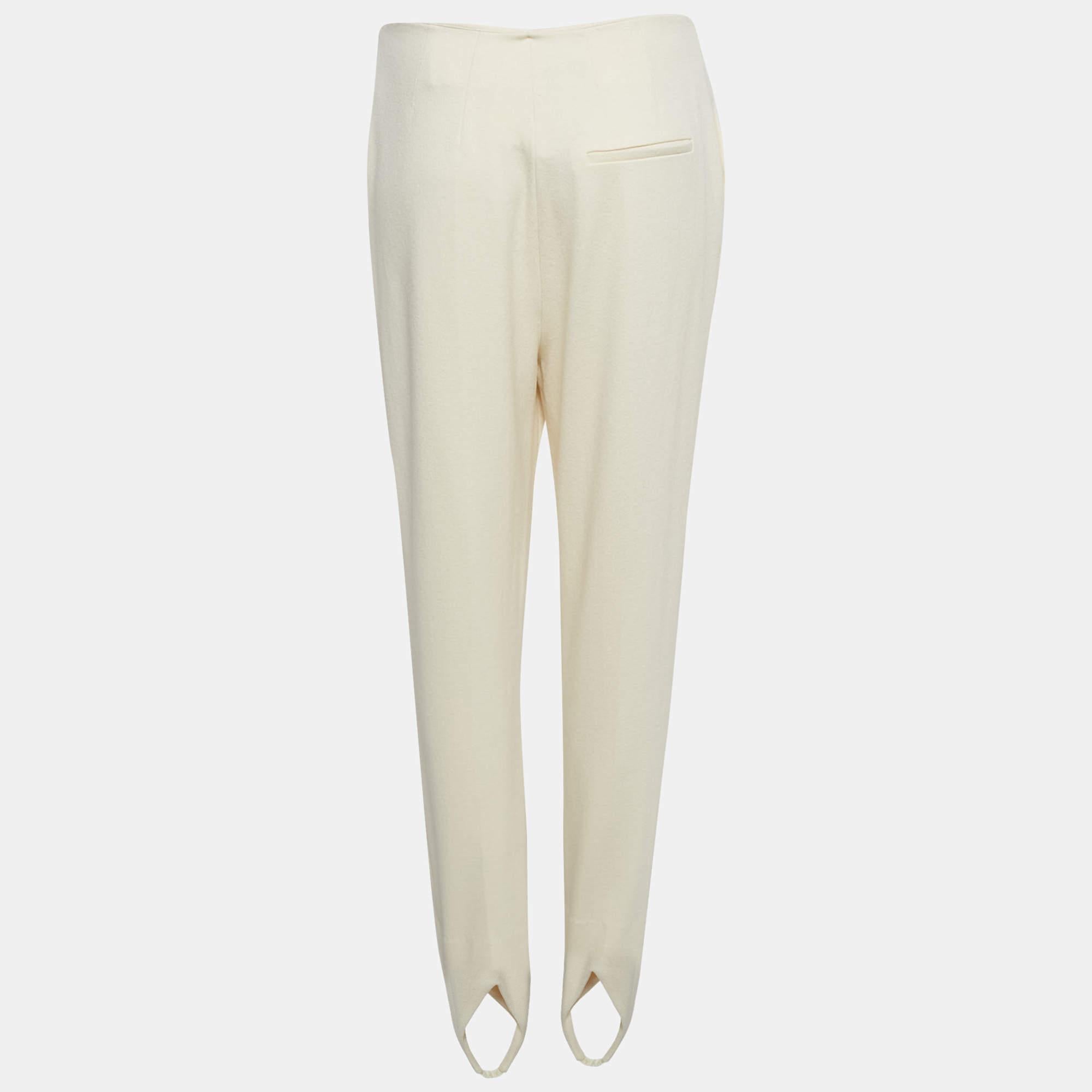 A more comfortable alternative to jeans or pants leggings are a closet must have. This Nanushka cream design is made from stretch jersey and cut to offer a fab fit.