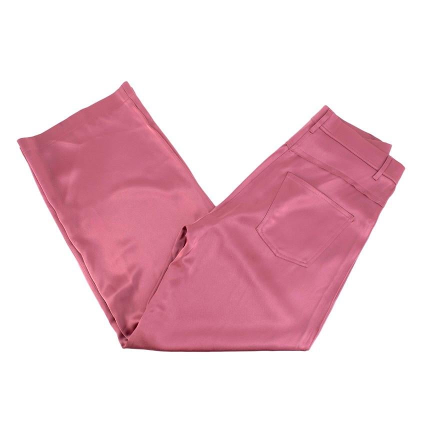  Nanushka Marfa Satin Pink Straight Leg Trousers

- Fluid heavyweight satin
- High-rise, cropped, straight-leg fit
- Two non-functioning pockets at the front and two patch pockets at the back
- Features belt loops, zip & button fastening 
-