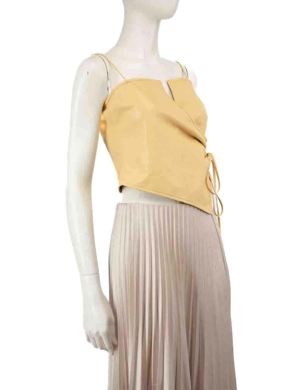 CONDITION is Good. Minor wear to top is evident. Light wear to the leather surface with some small spots of light discolouration seen at the left side of the back on this used NANUSHKA designer resale item.
 
 
 
 Details
 
 
 Yellow
 
 Leather
 
