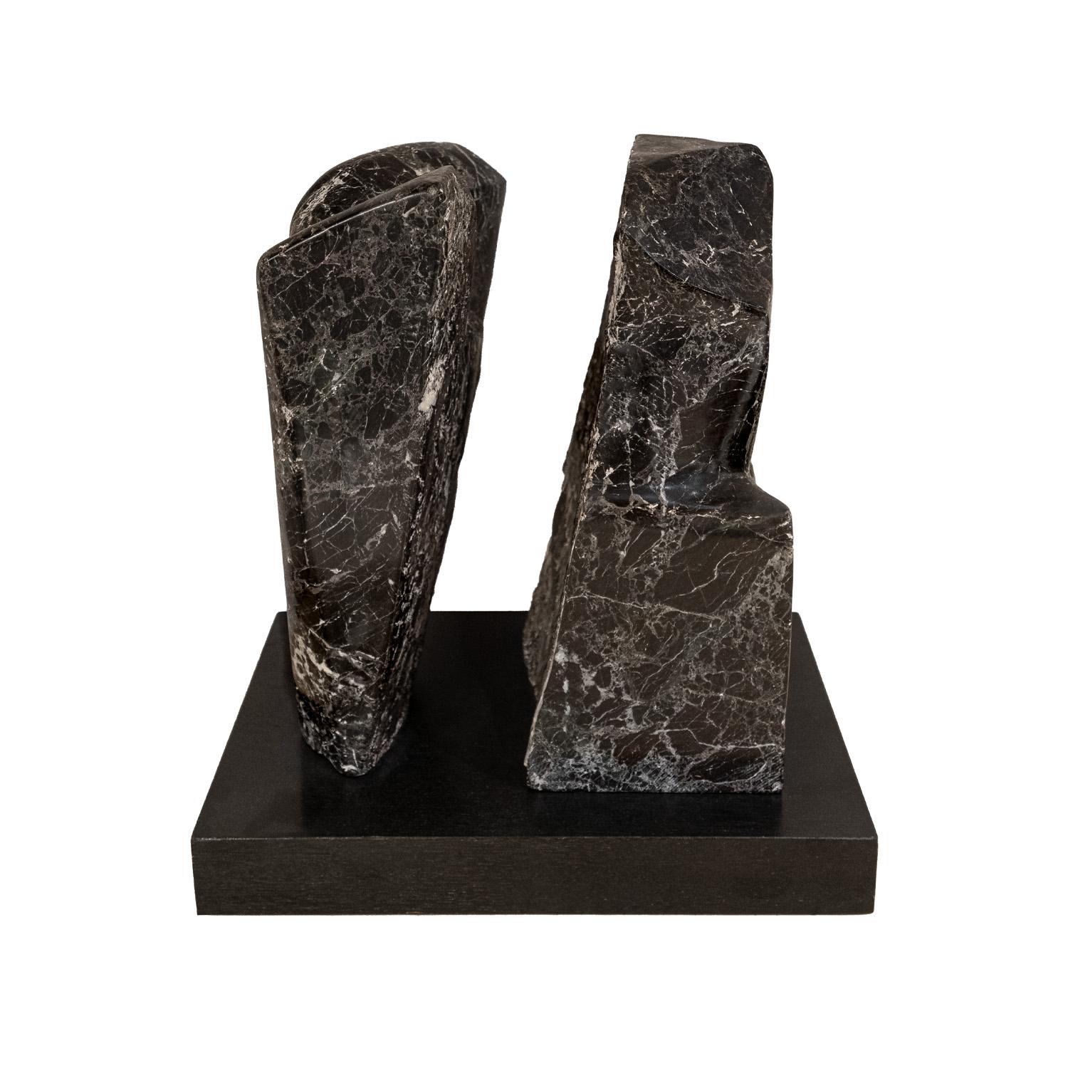 Extraordinary hand carved “Fractured Planet” sculpture in Italian Red Levanto marble on an ebonized wood base by Naomi Feinberg, American 1960’s.

Naomi Feinberg was a New York based sculptor who worked primarily in stone. She began sculpting in the