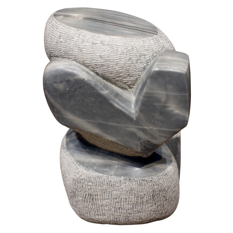 Hand-carved “Visitor” sculpture in grey granite by Naomi Feinberg, American, 1970s.

Naomi Feinberg was a New York based sculptor who worked primarily in stone. She began sculpting in the 1940s and became affiliated with artist group Studio 725