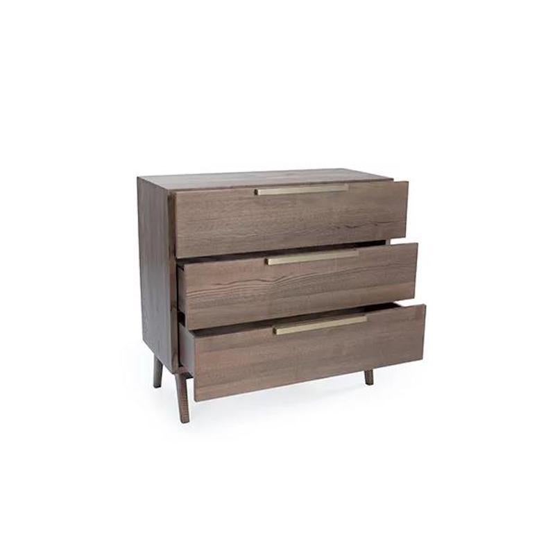 Dimensions: 36”W x 16”D x 34”H
Finish Shown: Shiitake

Inspired by bold architectural lines, the Napa collection exemplifies refined simplicity. It harmoniously joins wood and fabric to bring out the beauty of material and craftsmanship. The brass
