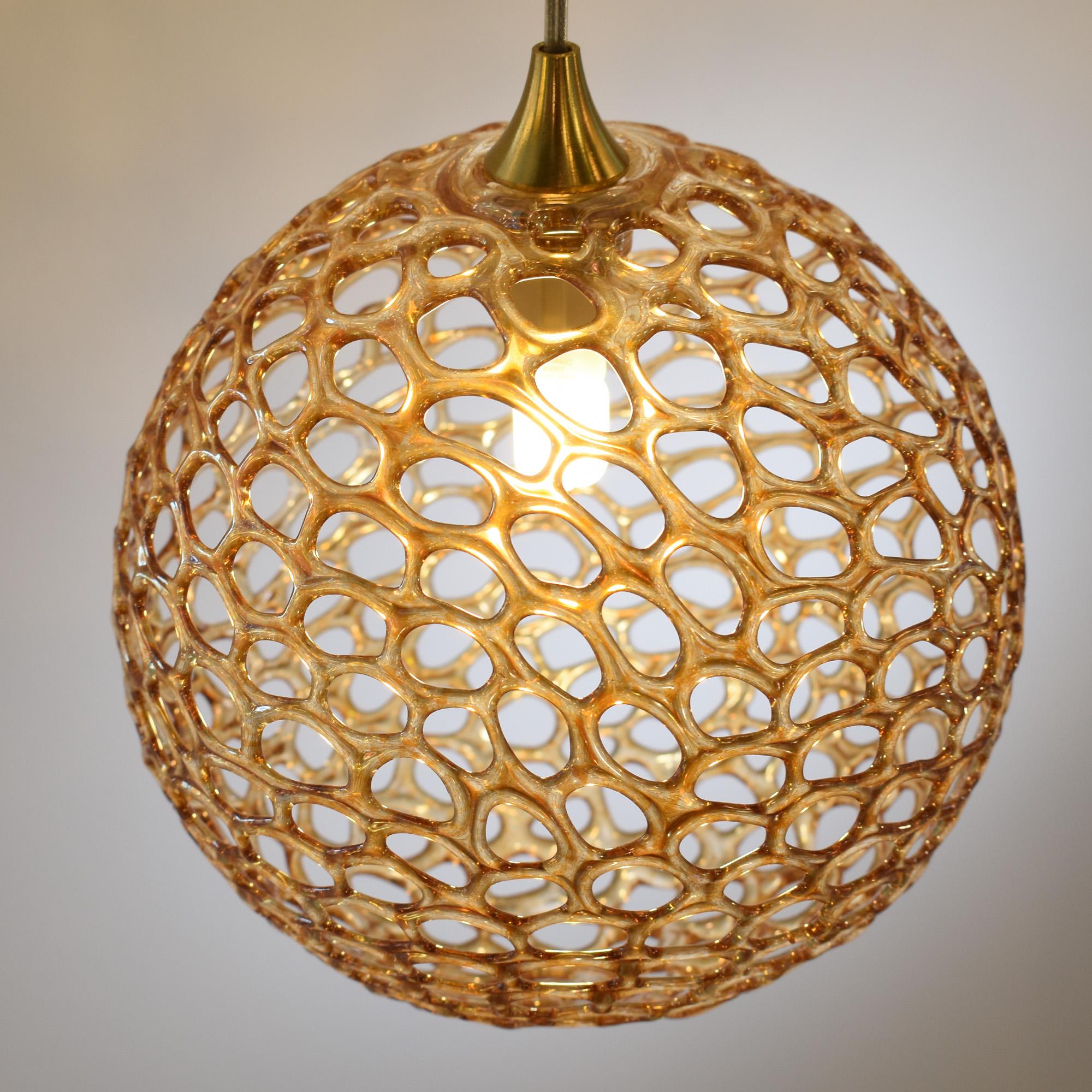 The Napa Chandelier will light your space surfaces with a warm and natural light while creating magical games of light and shadows on your room walls and ceiling. Glass spheres convey the concepts of lightness and transparency together with the