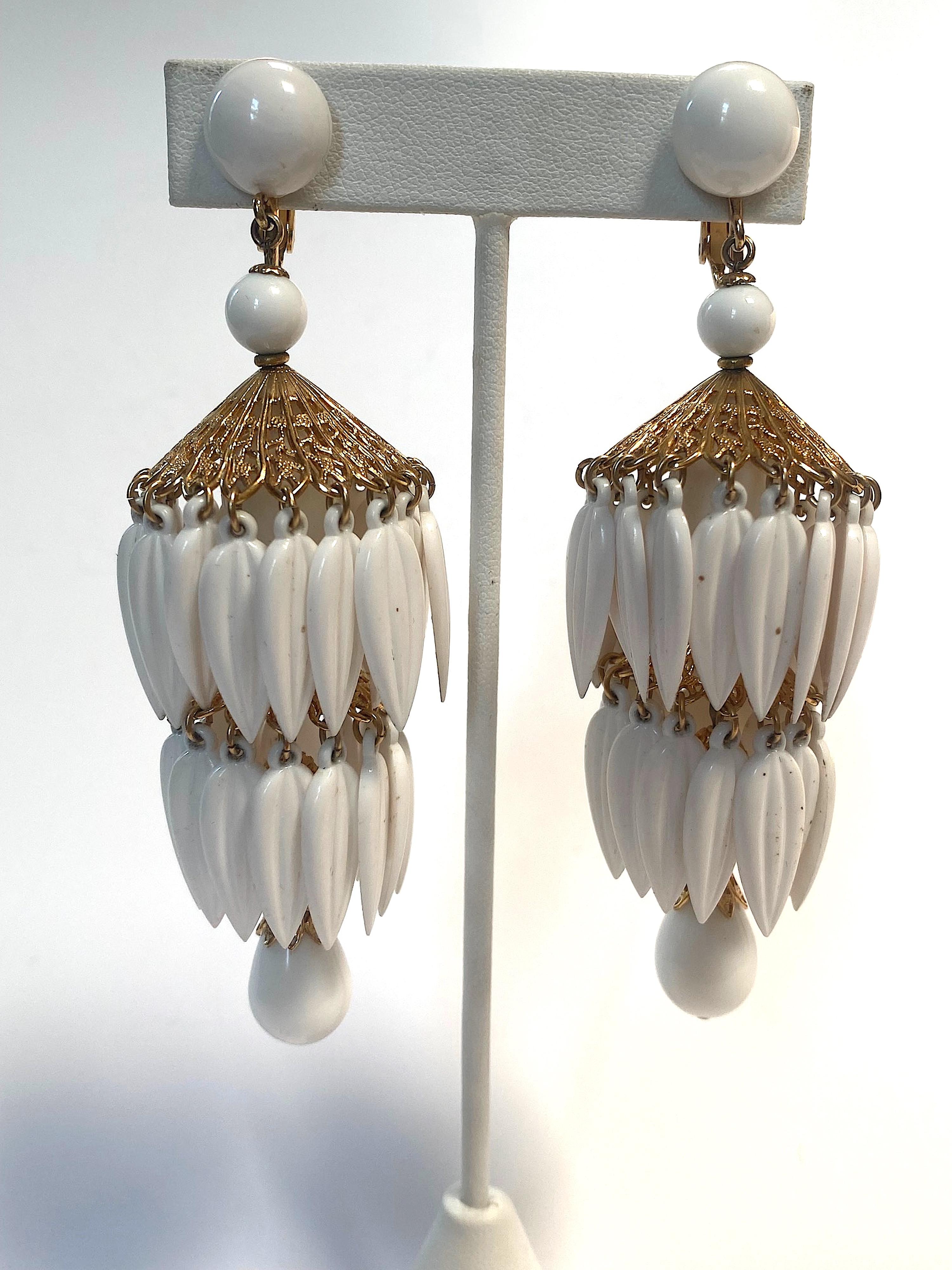 Presented is a beautiful and rare pair of 1960s large chandelier pendant earrings by American fashion jewelry Napier Co. Napier jewelry is notable for its simple, modern, geometric and floral designs. However, the company also produce boutique and