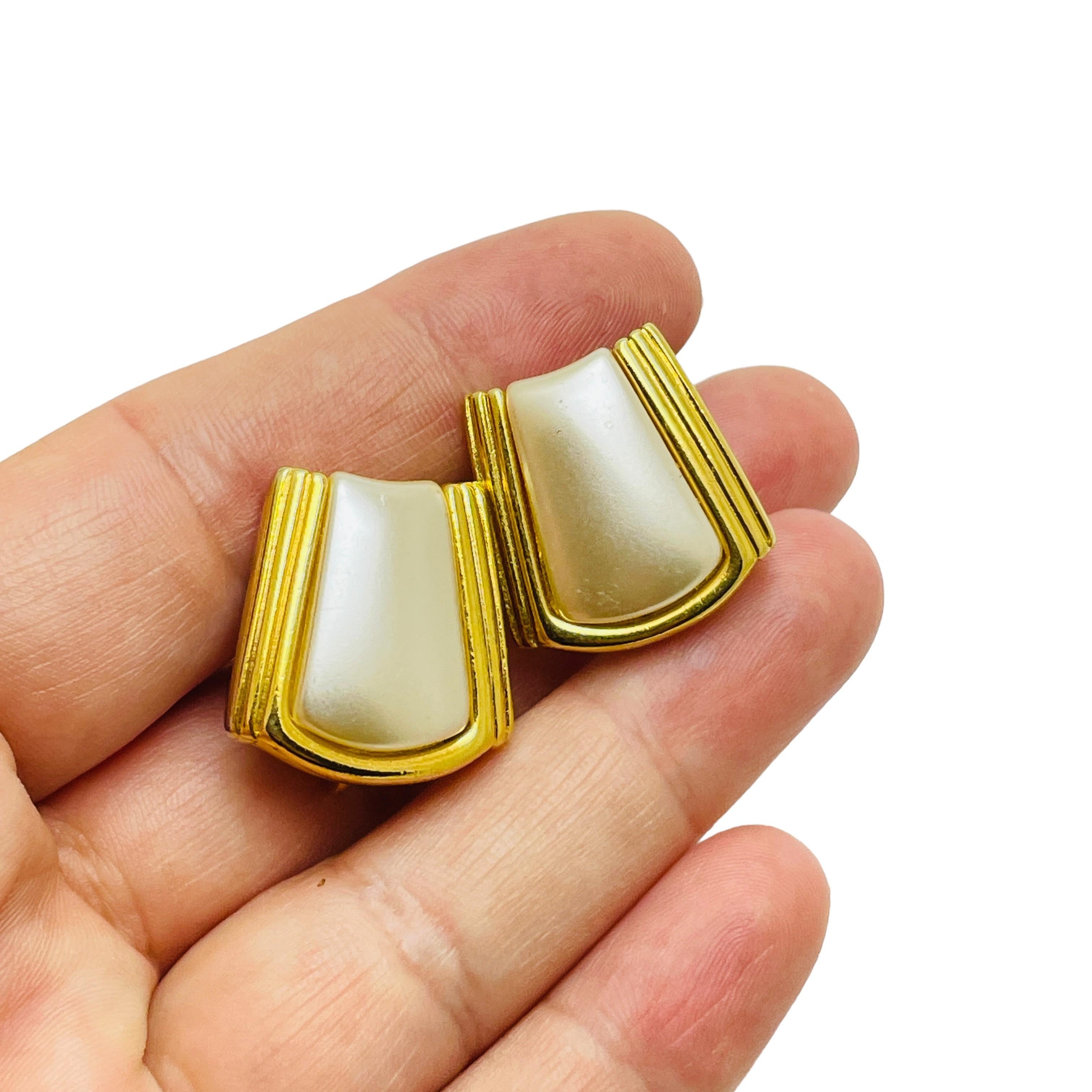 DETAILS

• signed NAPIER

• gold tone with faux pearl  

• vintage designer clip on earrings 

MEASUREMENTS  

• 3/4