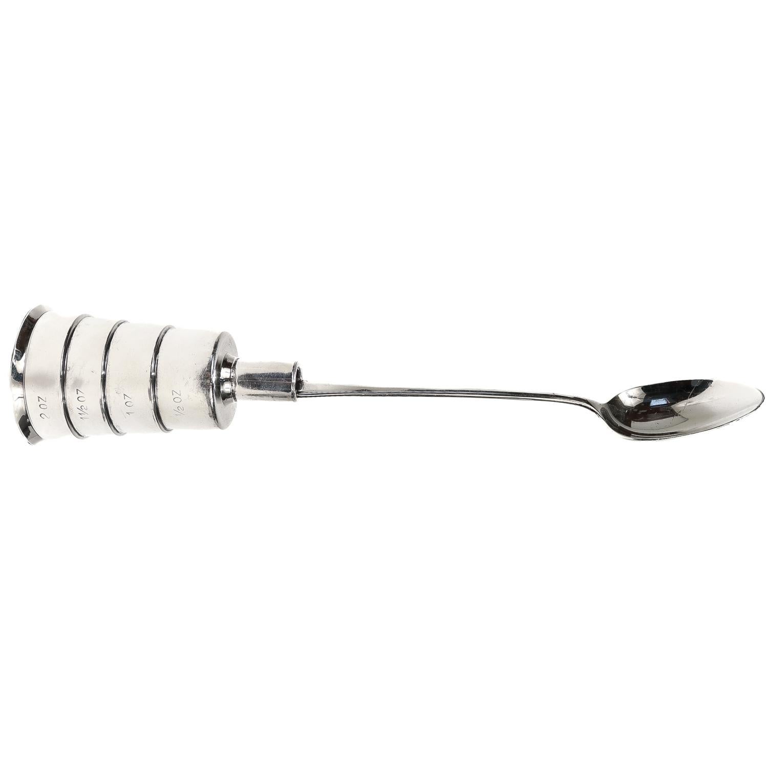 A fine Mid-Century or Machine Age bar tool.

In sterling silver.

By Napier.

Designed as a combined liquor measure (jigger) and cocktail spoon. 

Marked to the outside of the measure in 1/2 fl. oz volume increments.

Smartly designed so that when