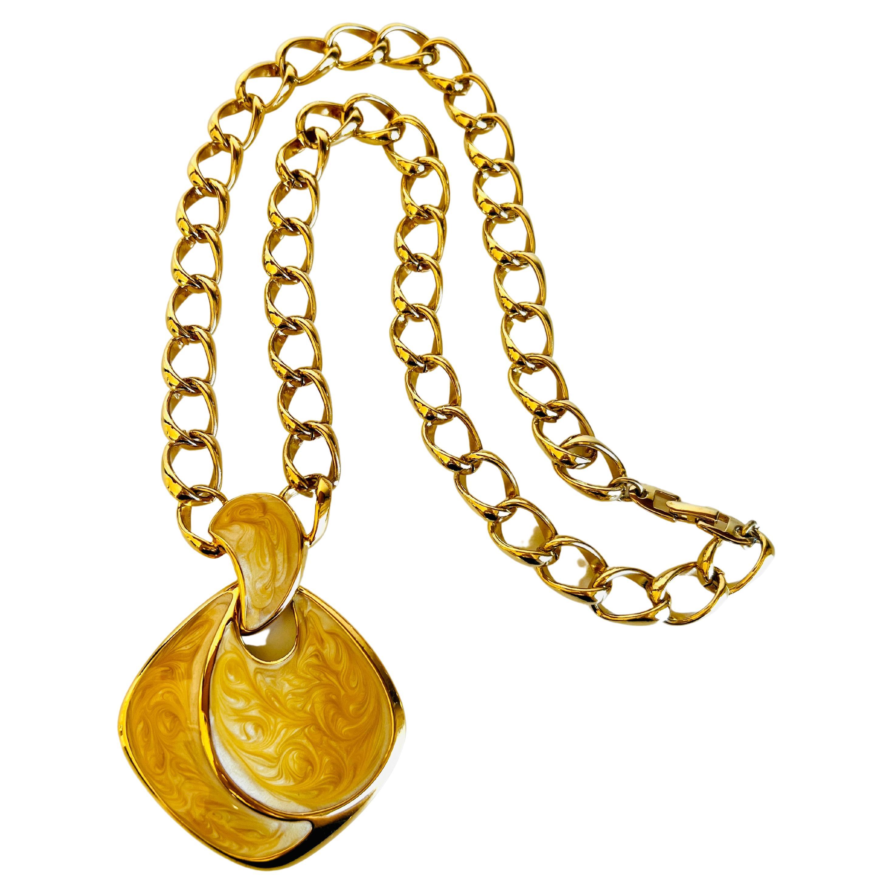 Fabulous gold chain necklace featuring a large yellowish gold enamel pendant by Napier. 

Length: 24