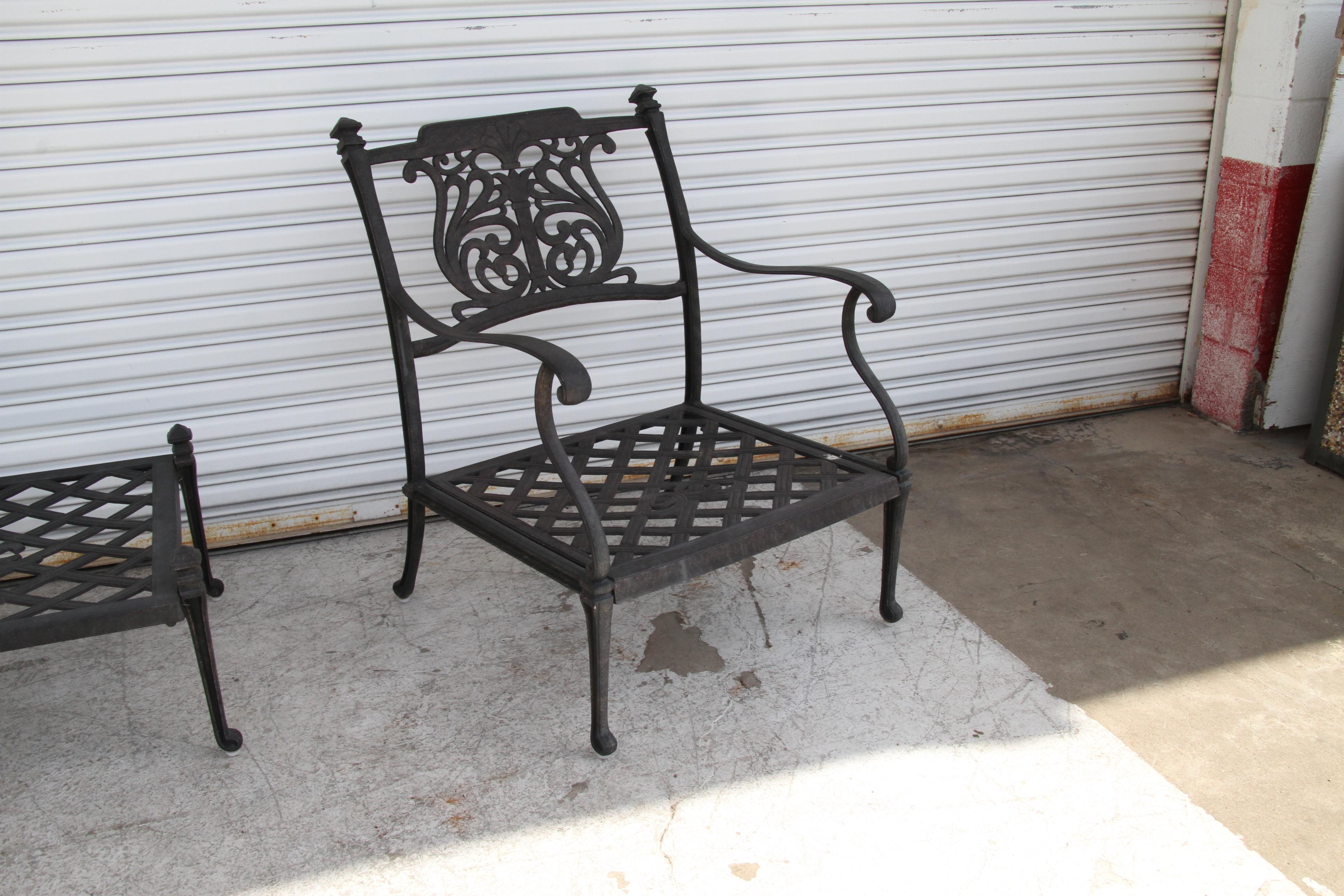 Patio set features a durable powder coated finish that will weather the harshest of outdoor conditions. Chairs and ottoman feature canvas sky blue cushions. Sand-cast aluminum frame ornamented with skillfully carved floral designs and lattice