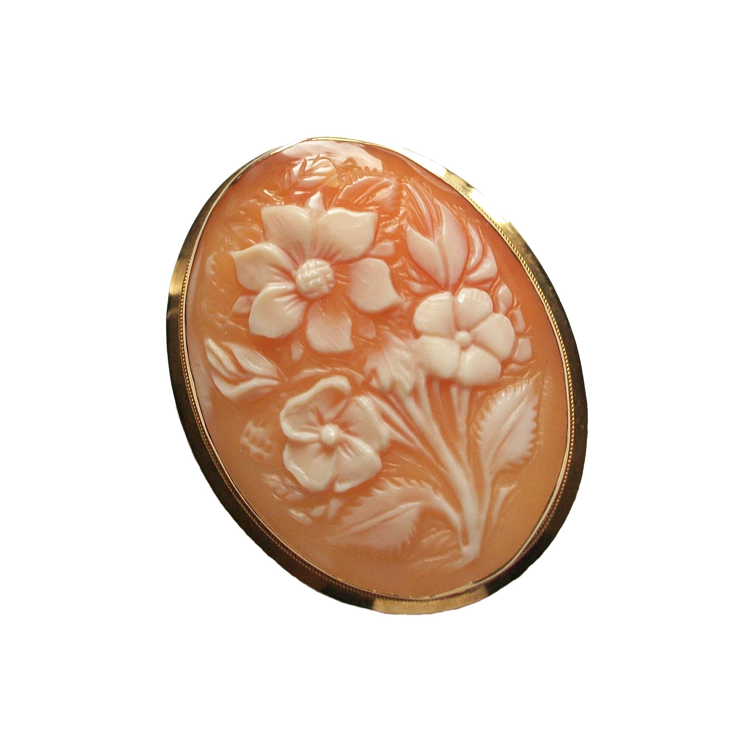 Vintage Naples floral shell cameo pendant or brooch - 18K/750 yellow gold frame, pin and bale - retractable bale to wear as a brooch - fine quality workmanship and detail - Italian hallmarks - Italy (Naples) - circa 1950's.

Excellent vintage