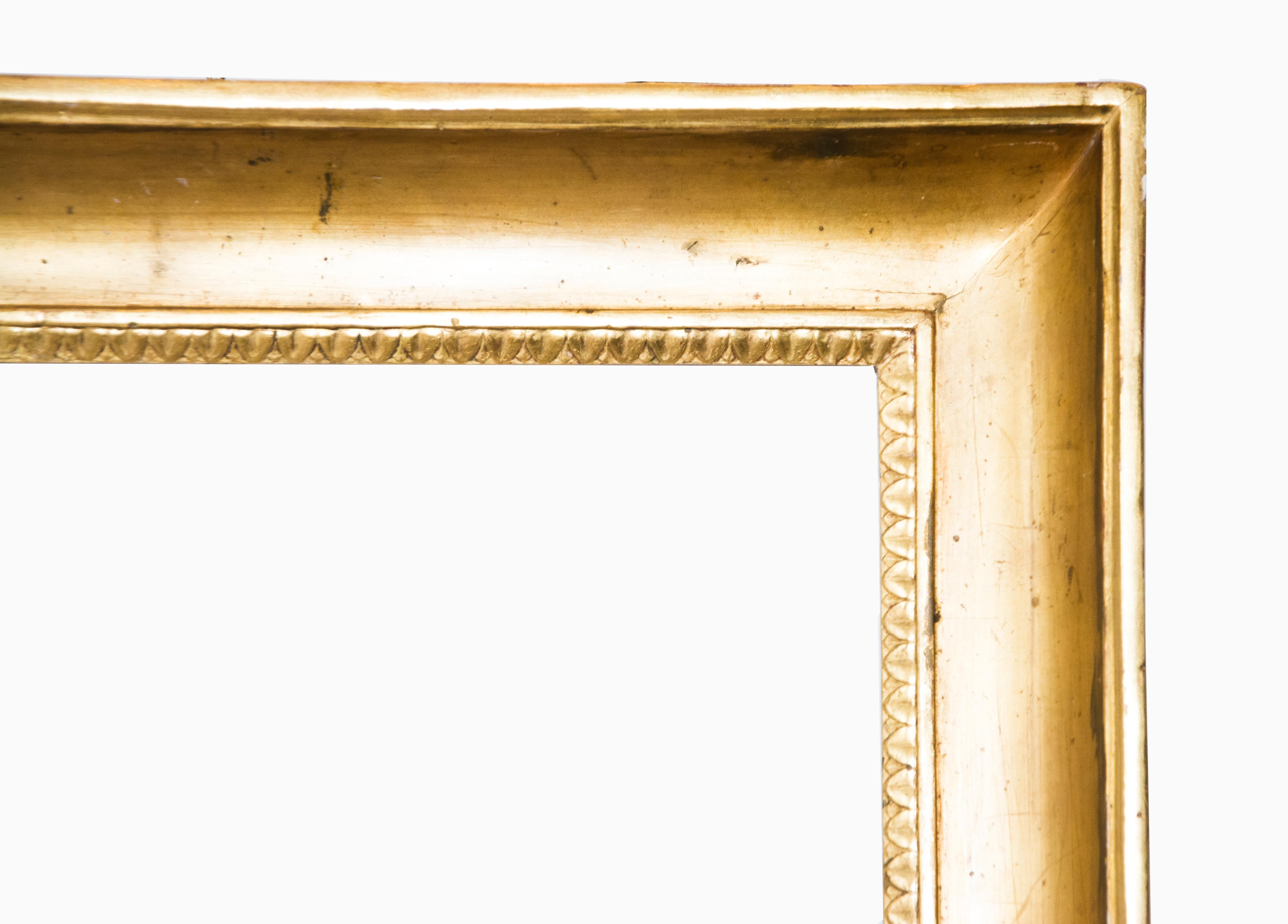 Naples frame, end of the 18th century.

Sculpted and gilded shell-shape frame decorated with ribbed leaves and leaflets.

Measures: Inside: 64.3 x 51.2 cm; outside: 77 x 63.7;
Depth is the wide of the band.