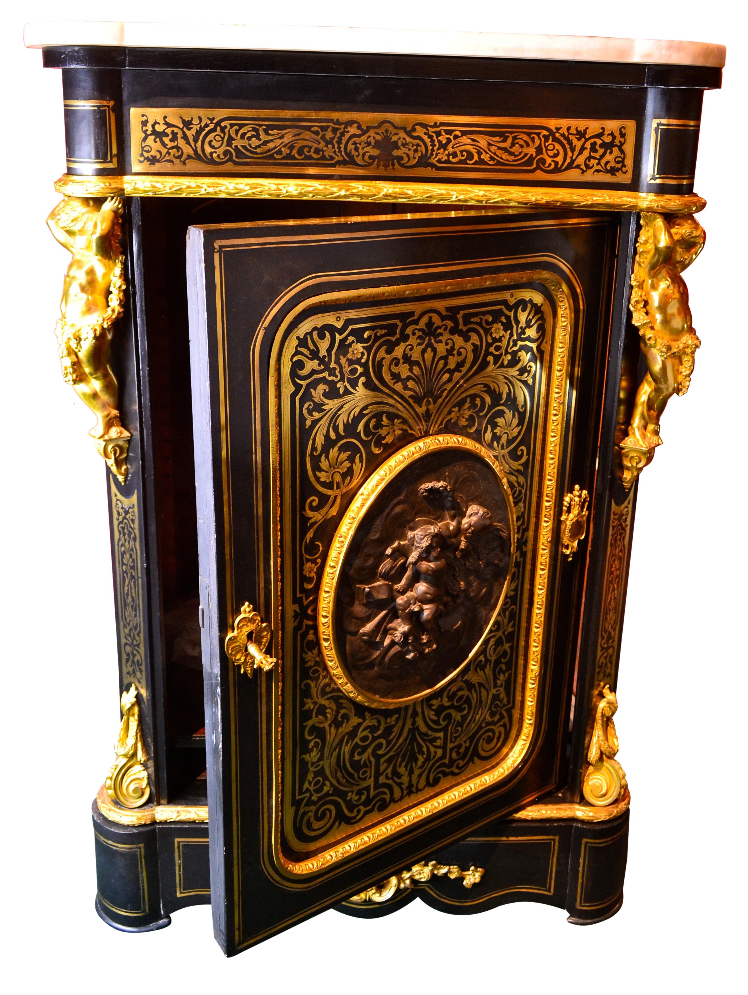 A gilt bronze mounted ebonized and brass inlaid cupboard or as the French refer to them a 