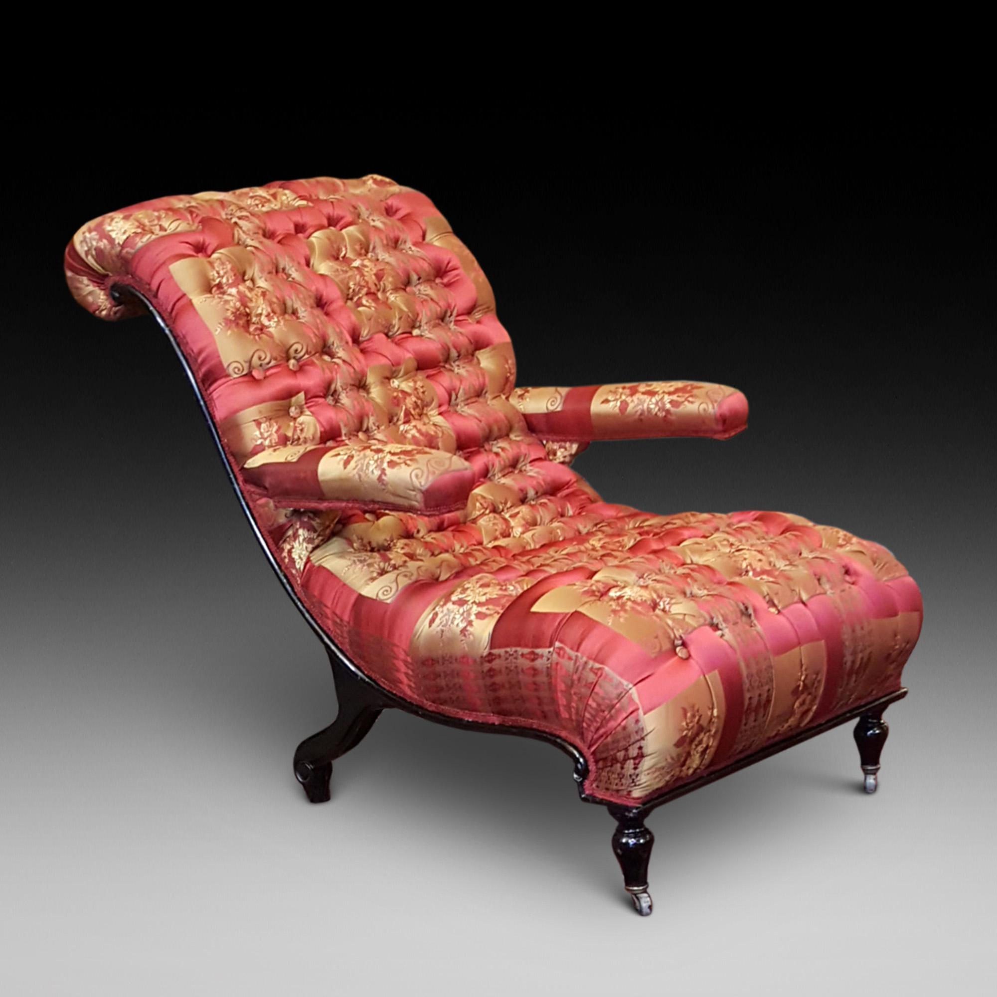Napolean III ebonized armchair, circa 1870 upholstered in buttoned red/gold silk, stylized shaped for on Horn castors 28