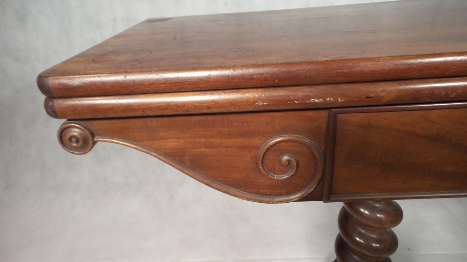 A really stunning antique Napoleon 111 games table in solid mahogany

The tabletop folds out, then twists to support it opening. Beneath is a compartment for cards and games pieces

The base is really quite beautiful with a heavy solid central