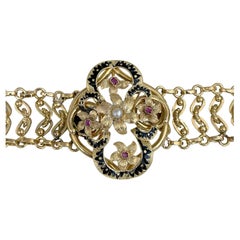 Bracelet Napoléon III en or 18 carats, émail noir, rubis et perles, chaîne florale
