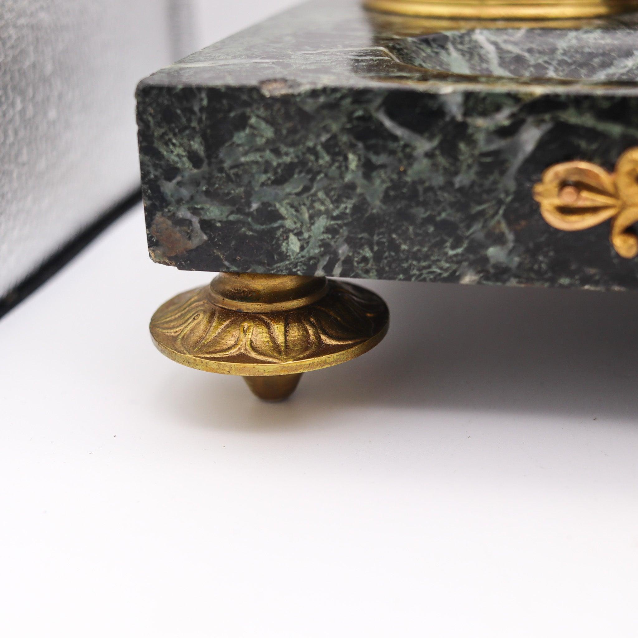 A Napoleon III desk set in marble and ormolu.

This is a beautiful and flamboyant desk tray set created in Paris France during the Napoleon III period, back in late 1860 and 1870. The highly decorative piece has been masterfully carved in gray-green