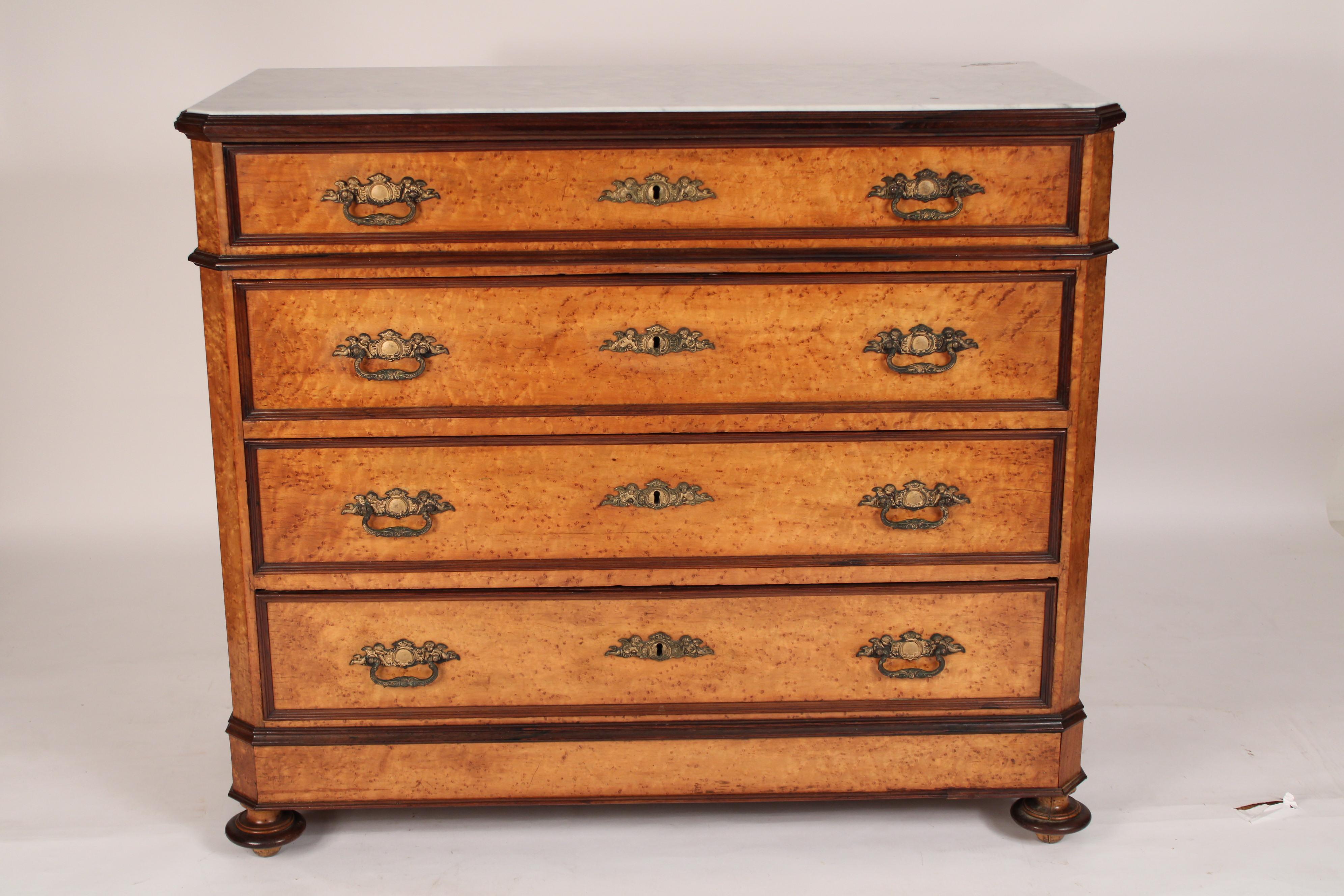 Napoleon III birdseye maple chest of drawers with marble top, circa 1870. With an inset white Carrera marble top with canted corners bordered with mahogany moldings, 4 birdseye maple drawers with mahogany molded borders and bronze drawer pulls and