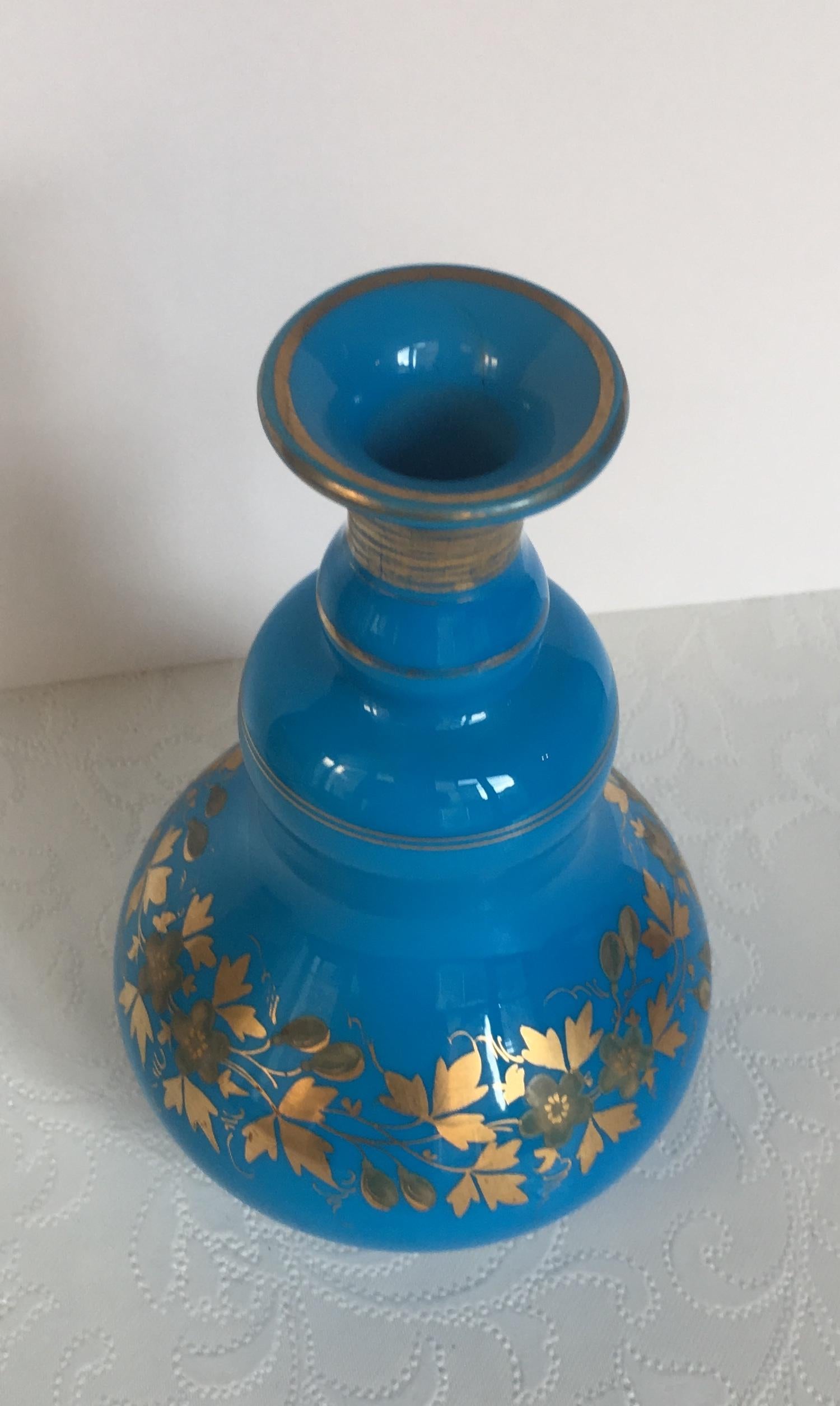 blue perfume bottle with flower top