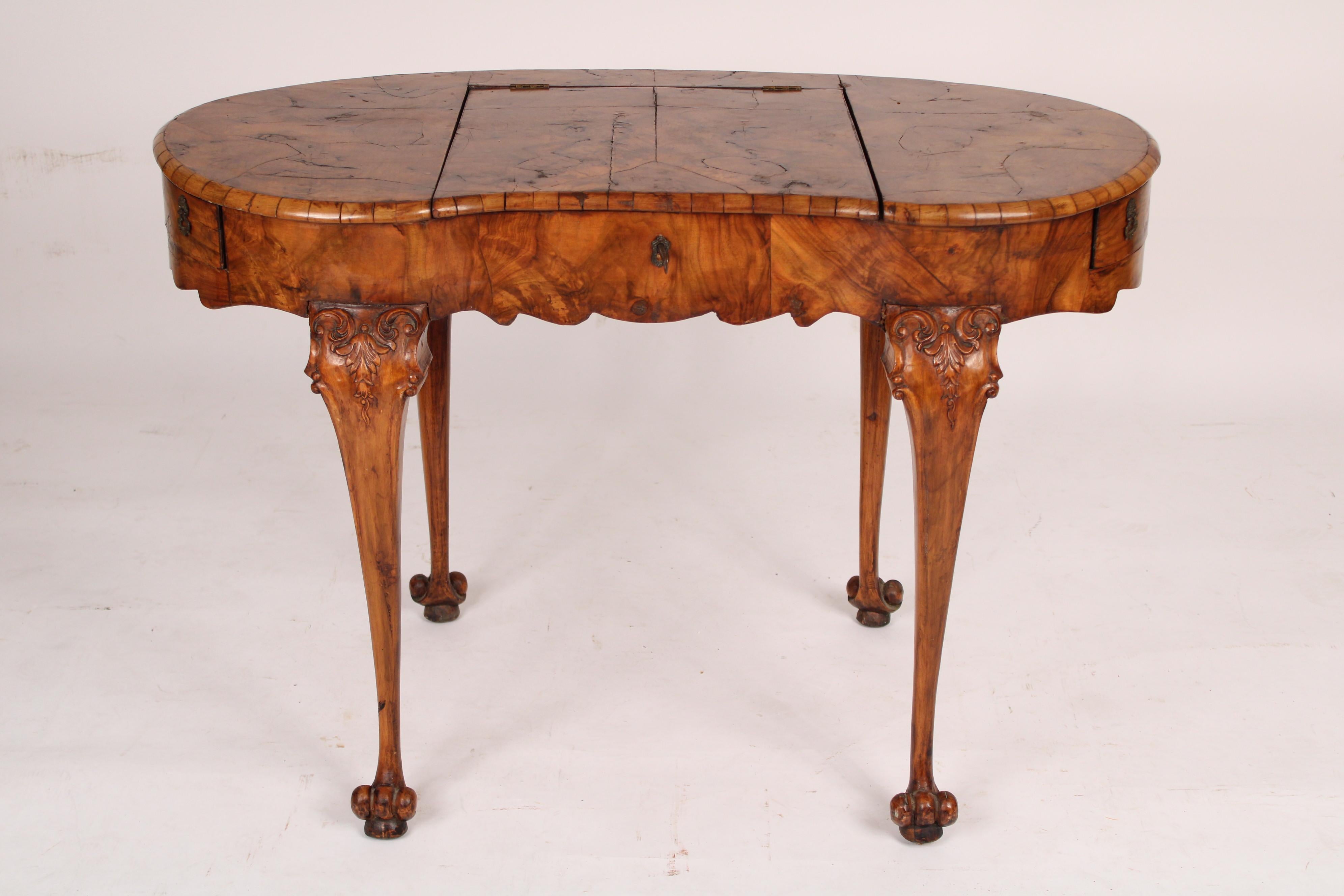 Antique Continental Louis XV style burl olive wood kidney shaped writing / poudre table, late 19th century. Kidney shaped top with center area with mirror that rises to be used as a vanity, frieze with scalloped apron and side drawers that open,