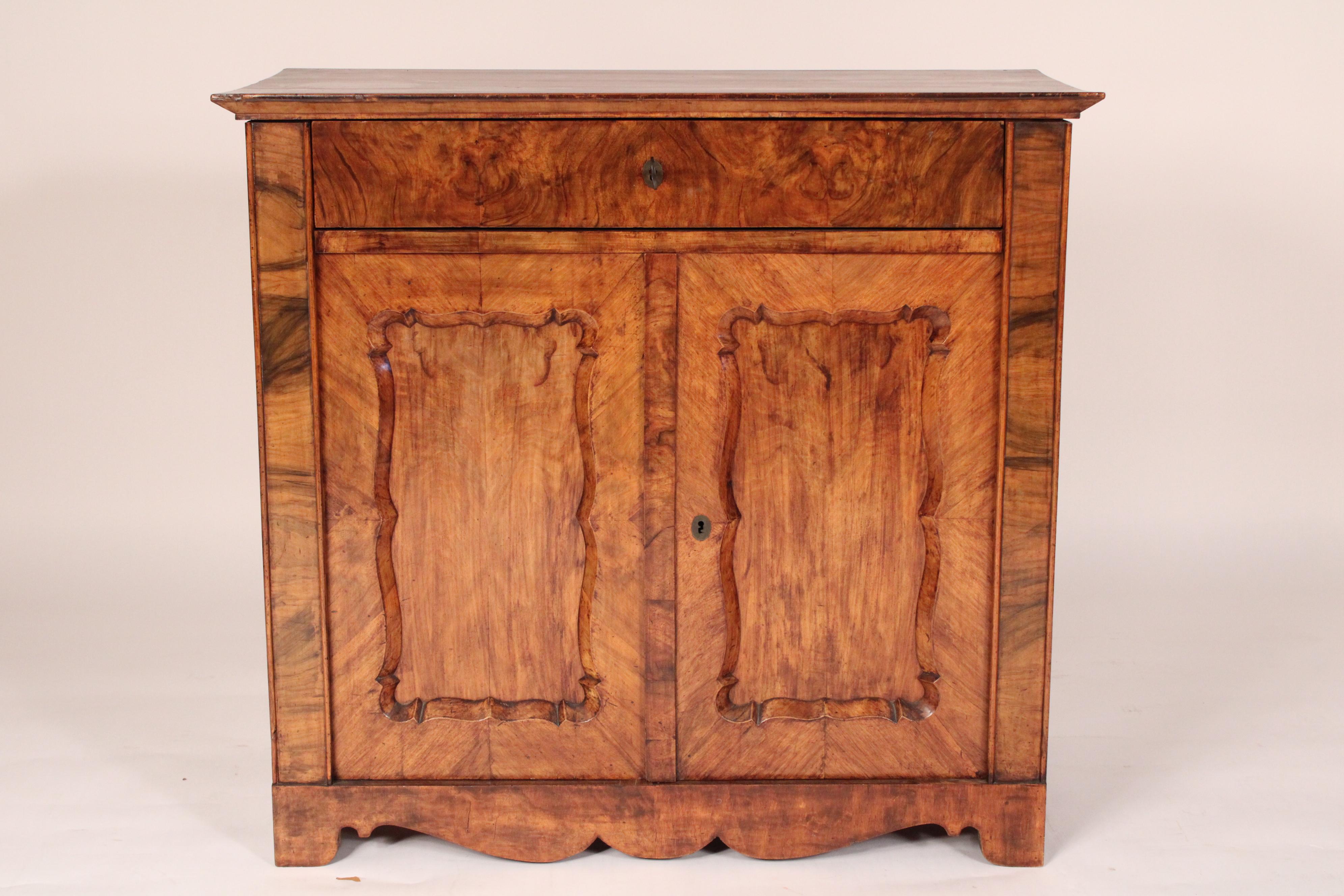 Napoleon III burl walnut two door cabinet, circa 1870. With an inset burl walnut top with walnut crossbanding, a burl walnut frieze drawer that has been converted to a fold down writing surface, two doors with inset burled walnut panels, nicely