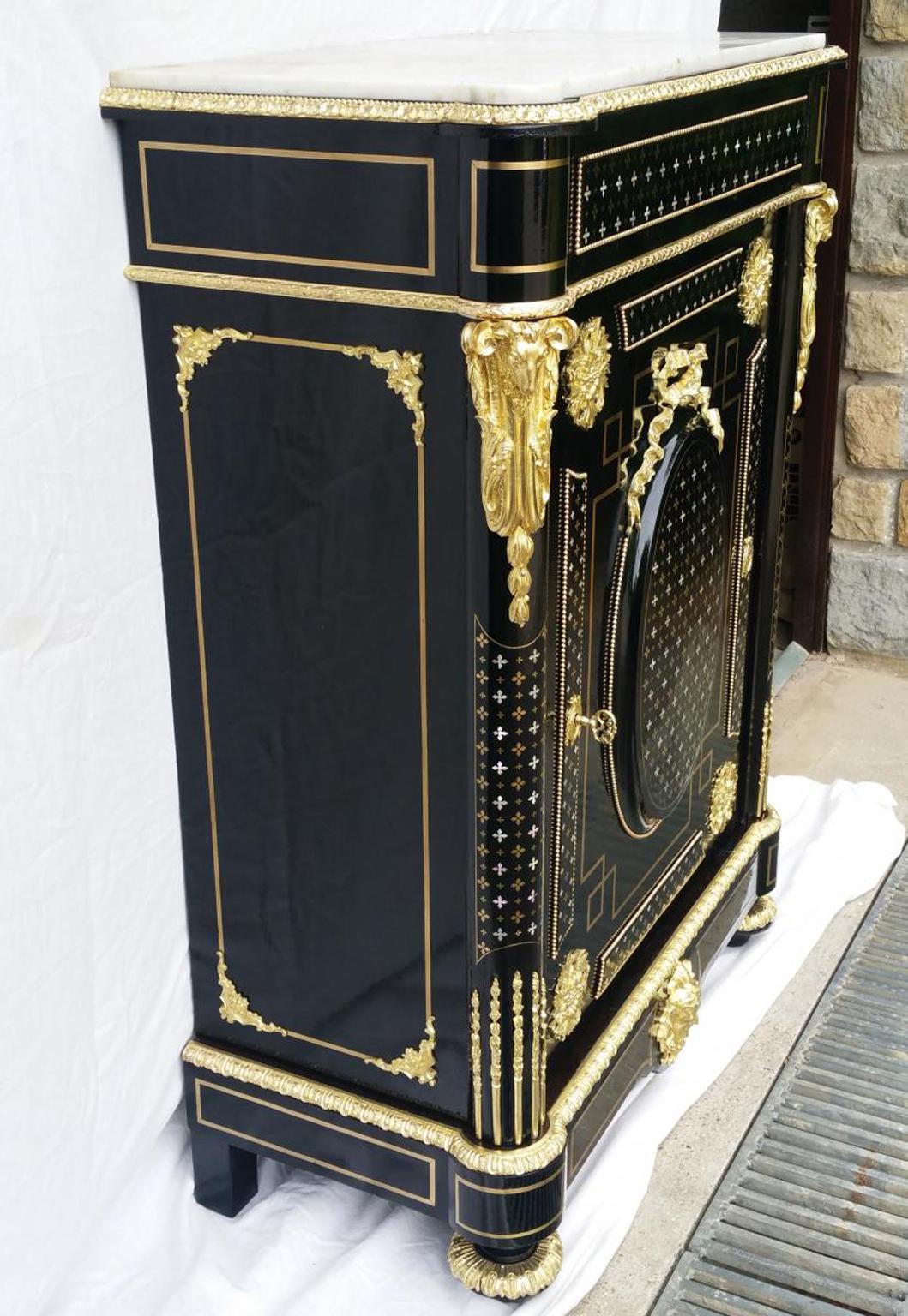 Atypical 1 door cabinet in ebony veneer and Boulle style marquetry in Brass and gorgeous mother of pearl and brass inlay work named 