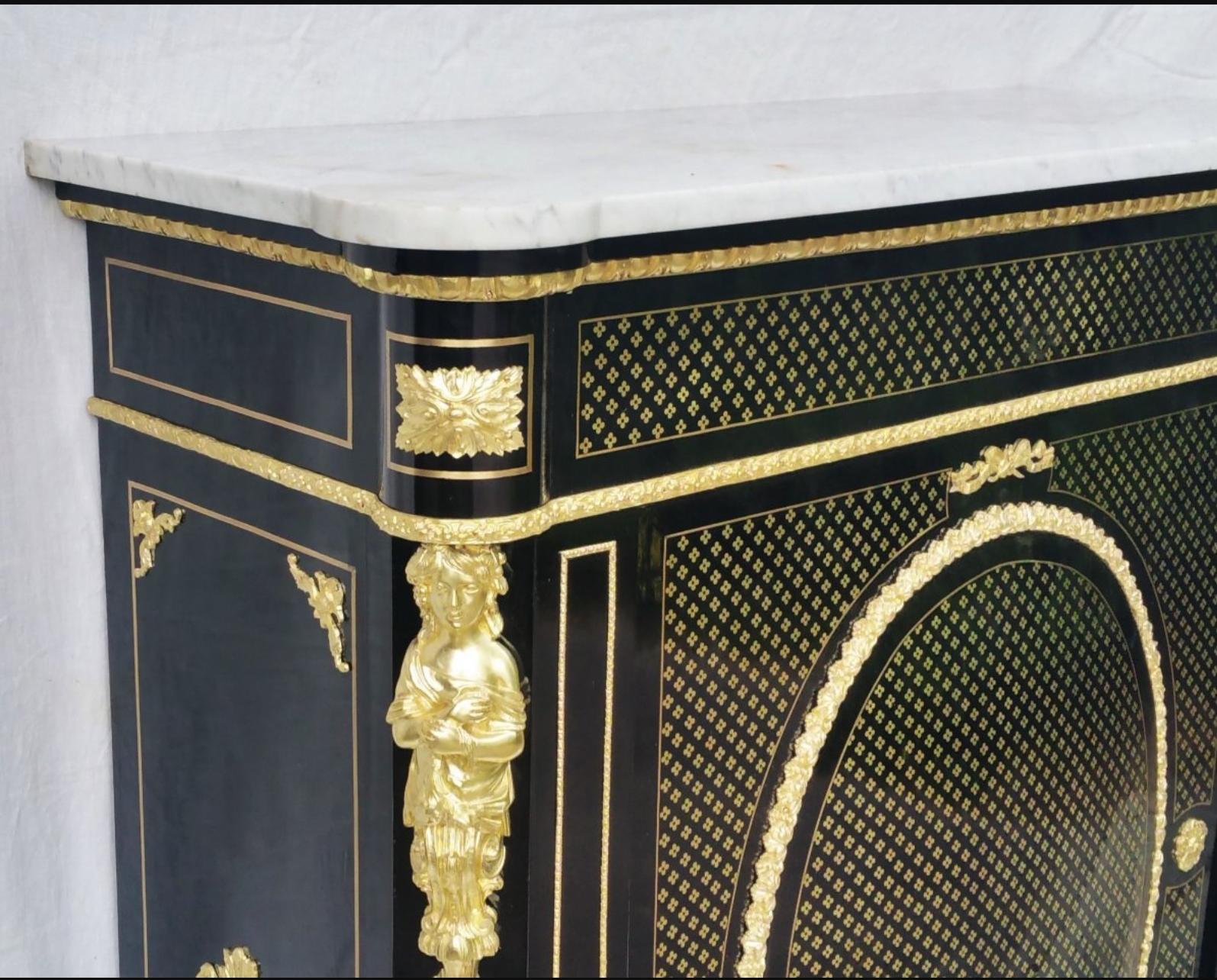 Gorgeous Napoleon III Boulle Marquetry style cabinet furniture with Queen style ornamentations in ebony veneer and with inlays of brass flowers in facade and brass threads on all sides. Beautiful ornaments of gilt bronze. Carrara marble top in