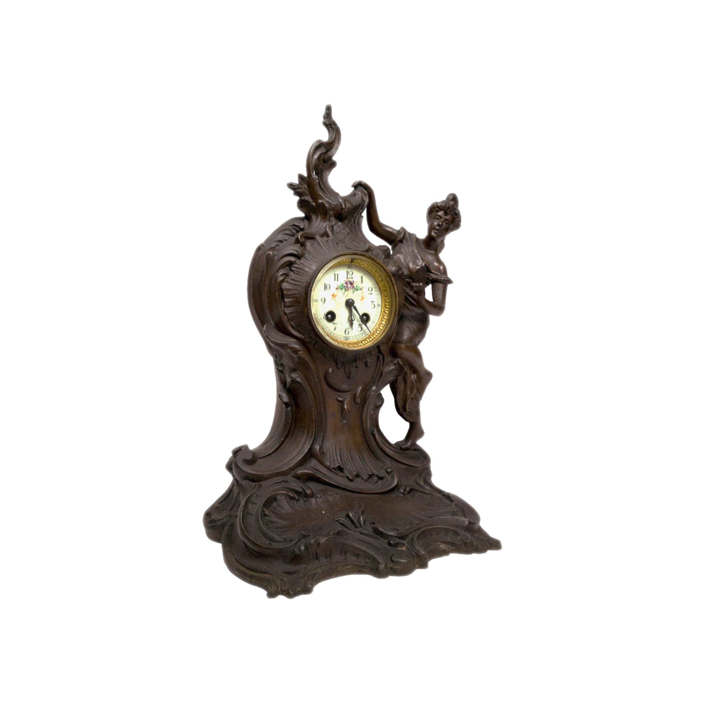A Napolean III period mantel chimney clock with a mark on the letterhead of the mechanism «horlogerie suisse 23 Rue d'Alsace Lorraine Toulouse» in french Rococo Revival style. Mechanism reviewed recently and in working conditons. 
The emanel golden