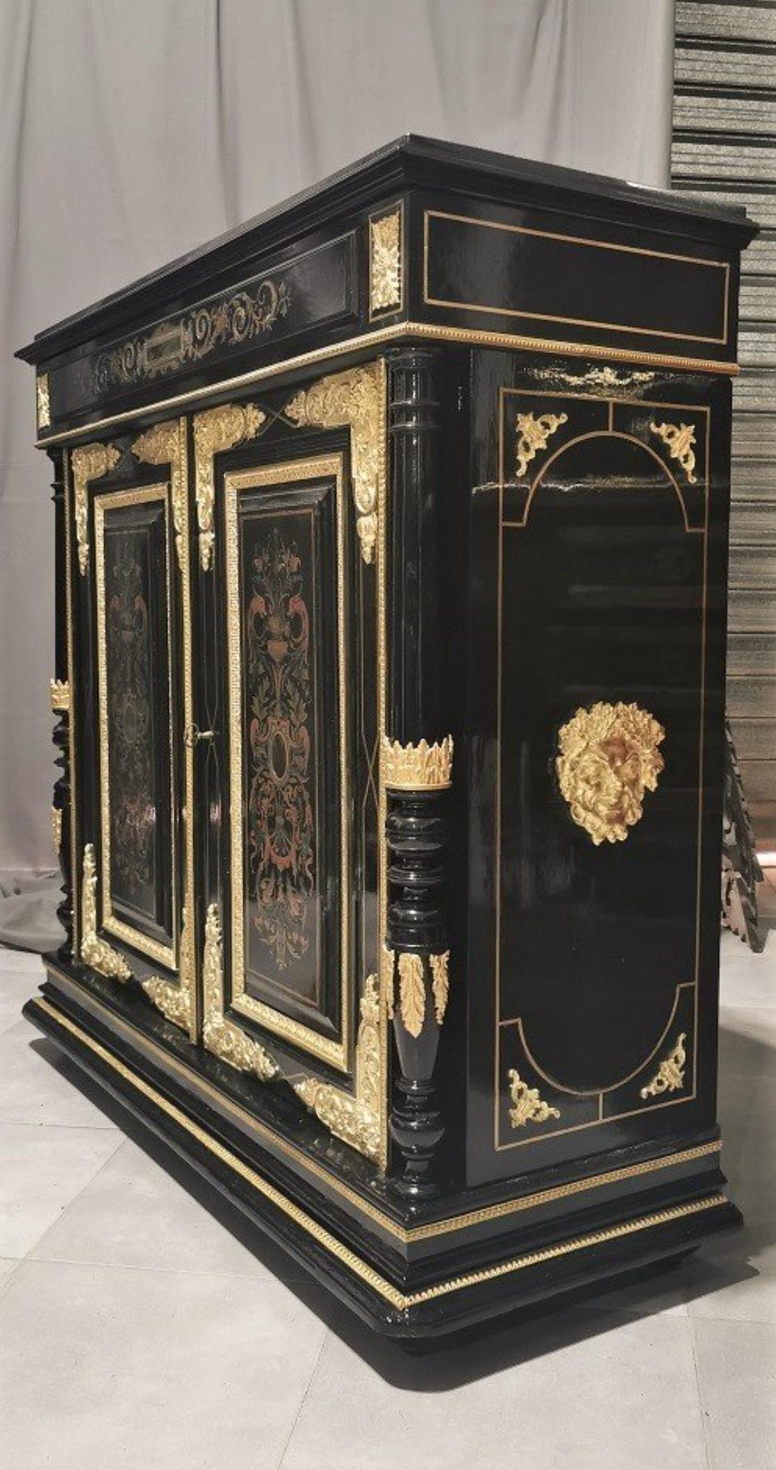Beautiful Napoleon III Cabinet in Boulle style Marquetery made in Brass, Copper and Pewter.
Openning by 2 doors with rich Bronze ornemantions, interior with 2 shelves. Black marble top totally repolished.
France 19th Century, circa