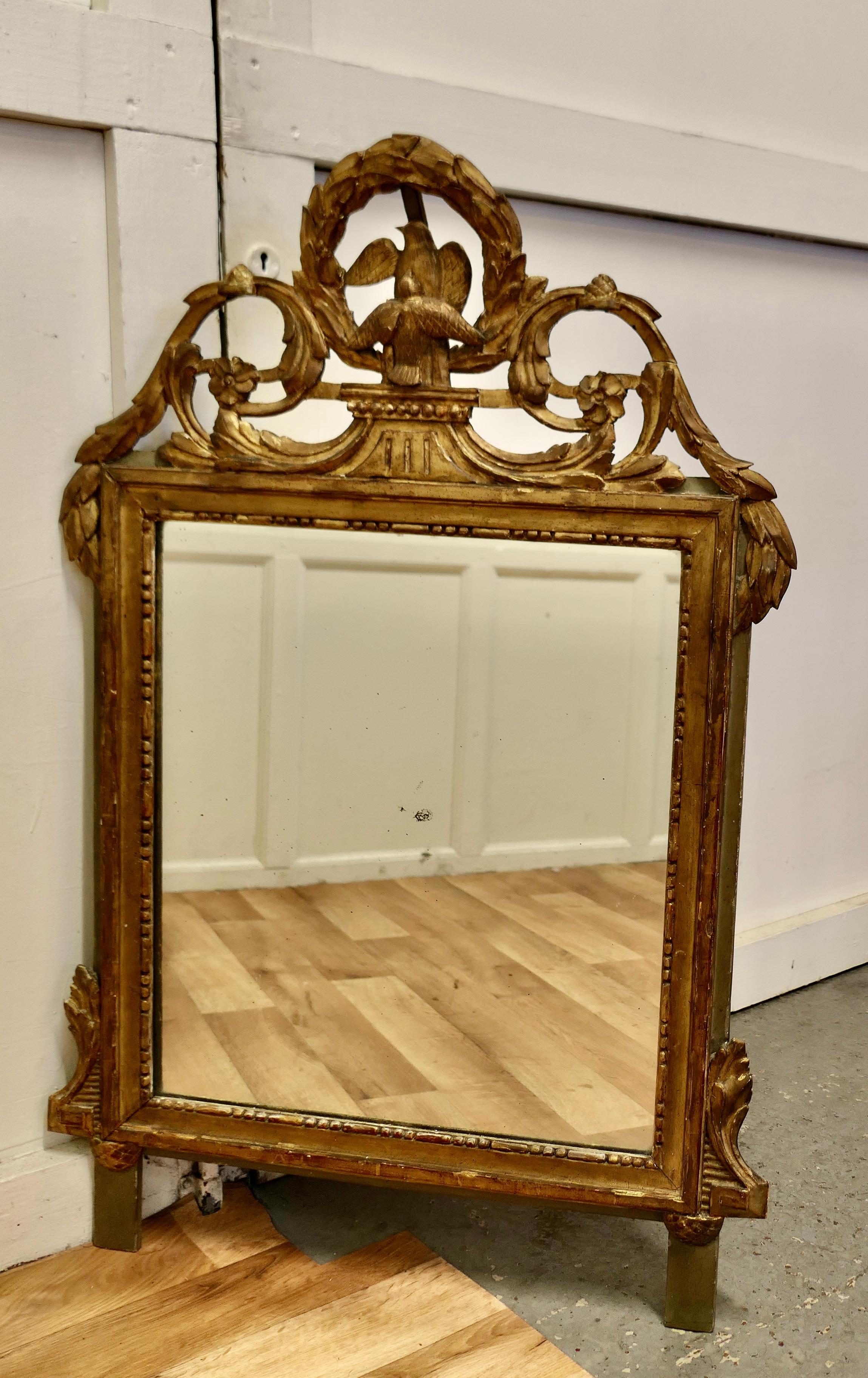 Napoleon III, crested wall mirror.

This is a very old and beautifully worn piece, the frame is distressed and slightly faded it has lost a little of its lustre now but the age darkened gold finish is still very attractive 

 The mirror frame