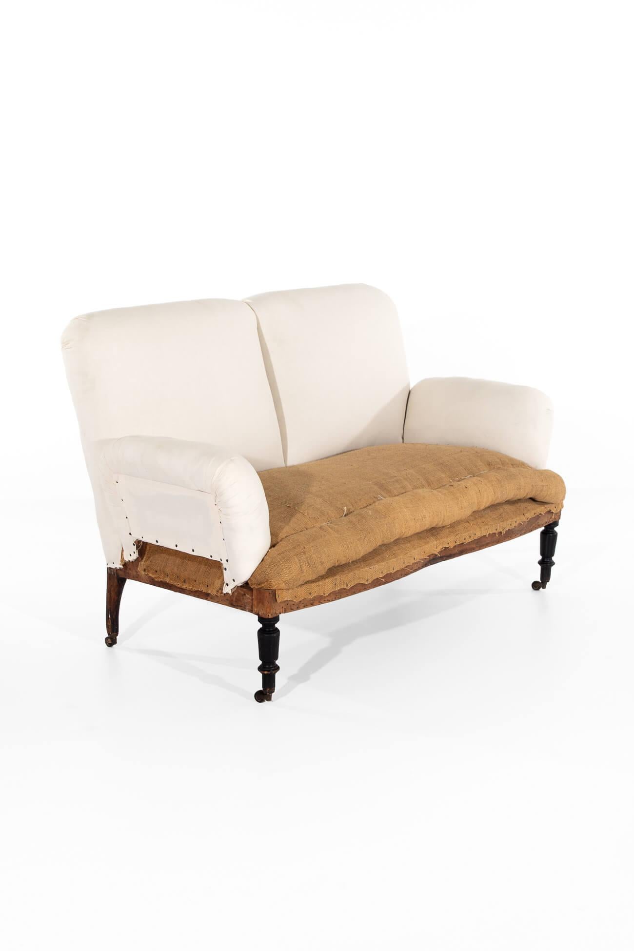 A splendid and generously proportioned Napolean III two-seater sofa.

The sofa has been fully restored, stripped back to the original solid walnut pegged frame with a new coil spring base, padding, hessian lining, and calico coverings added to the